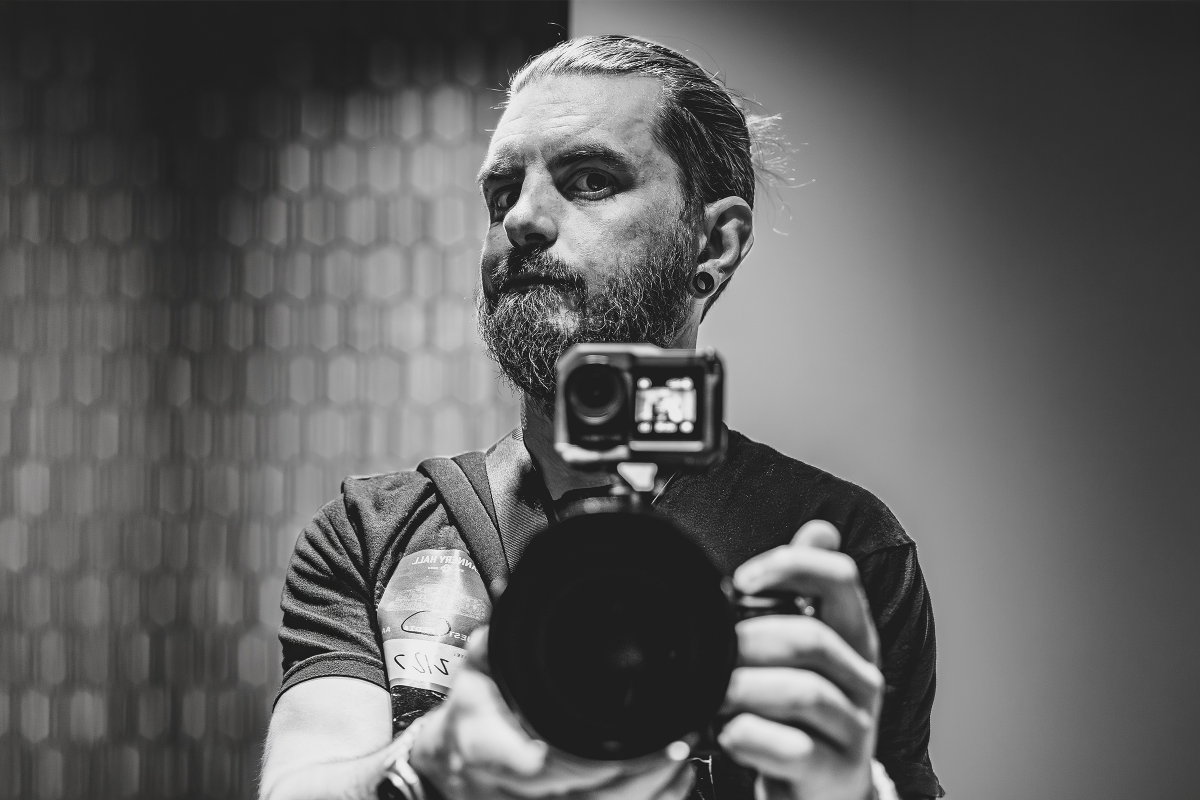 Photo of Alan (Bamacore) holding camera in a mirror.
