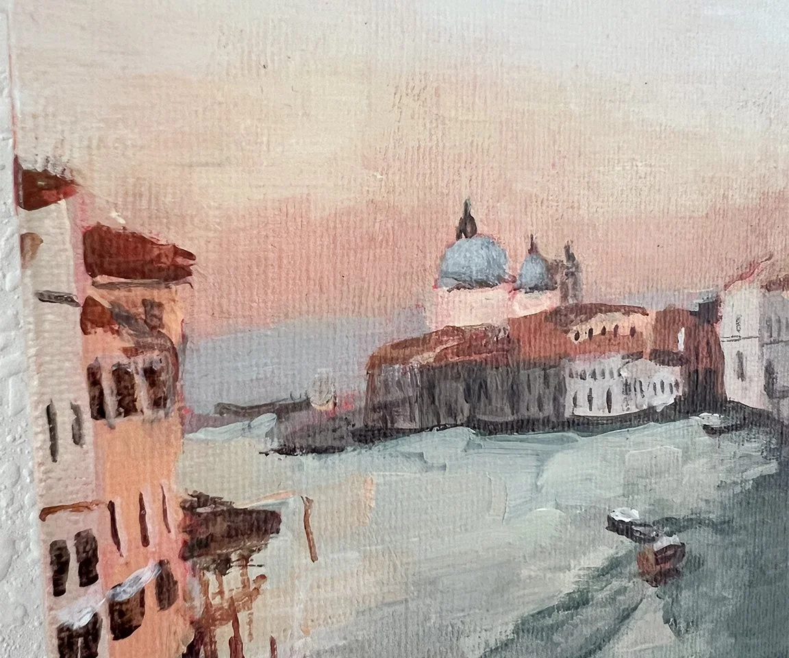 detail image of painted buildings and water