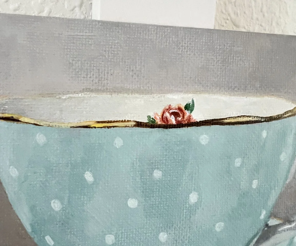 detail image of polka dot pattern and rose in cup