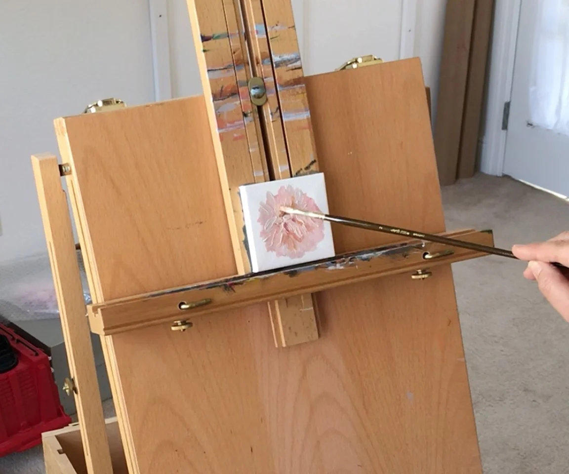 easel holding painting in progress of aster mum