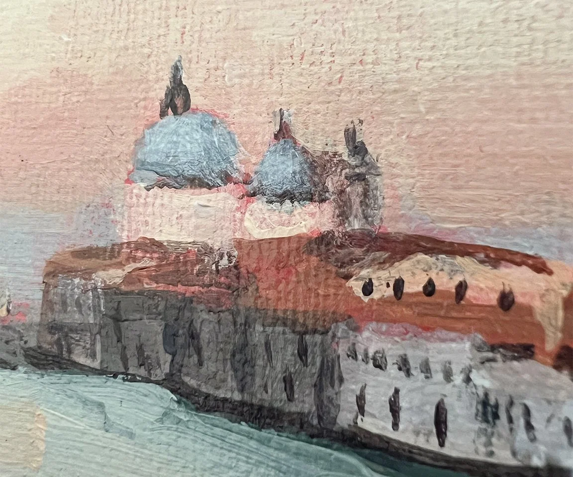 detail image of painted buildings and water