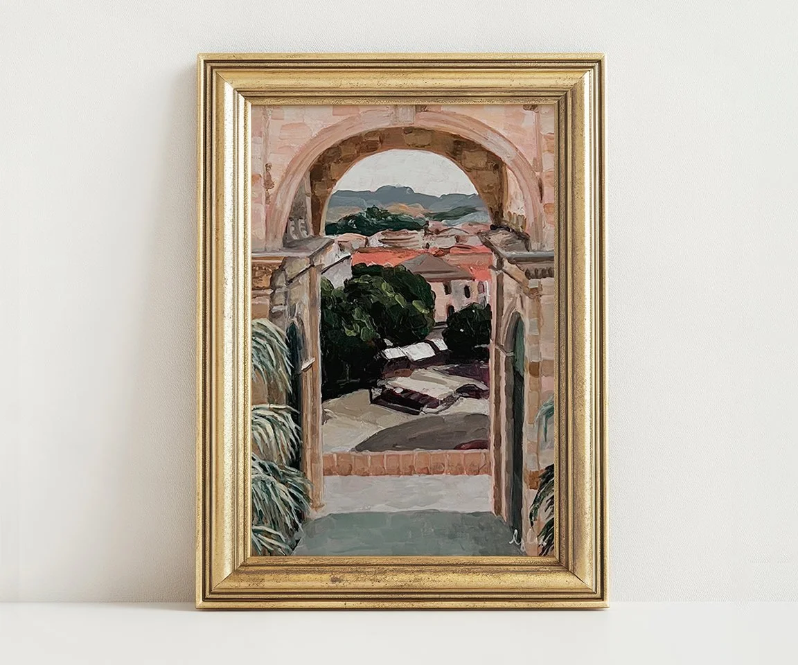 gold framed print of archway painting