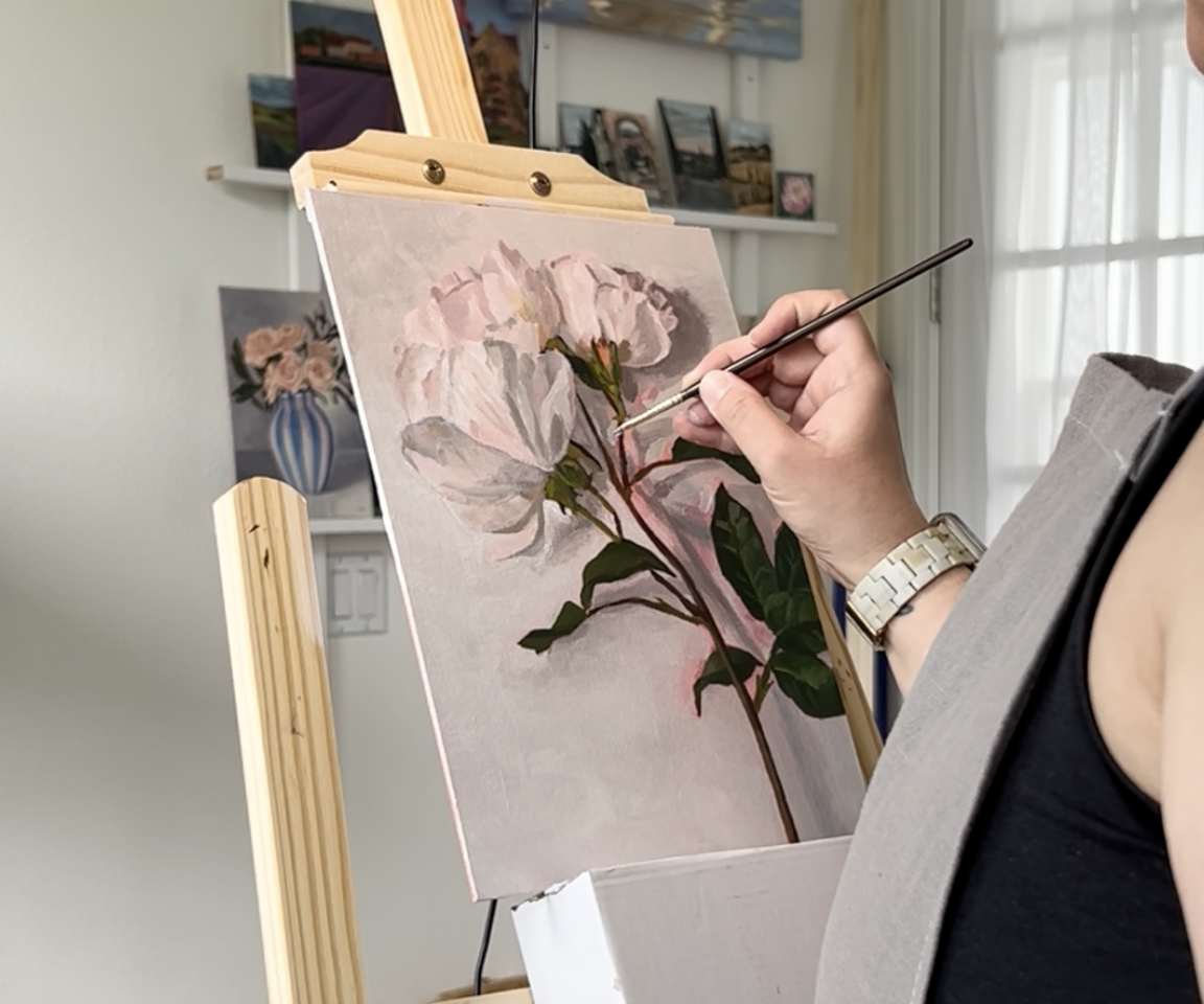 painting of roses on easel in progress
