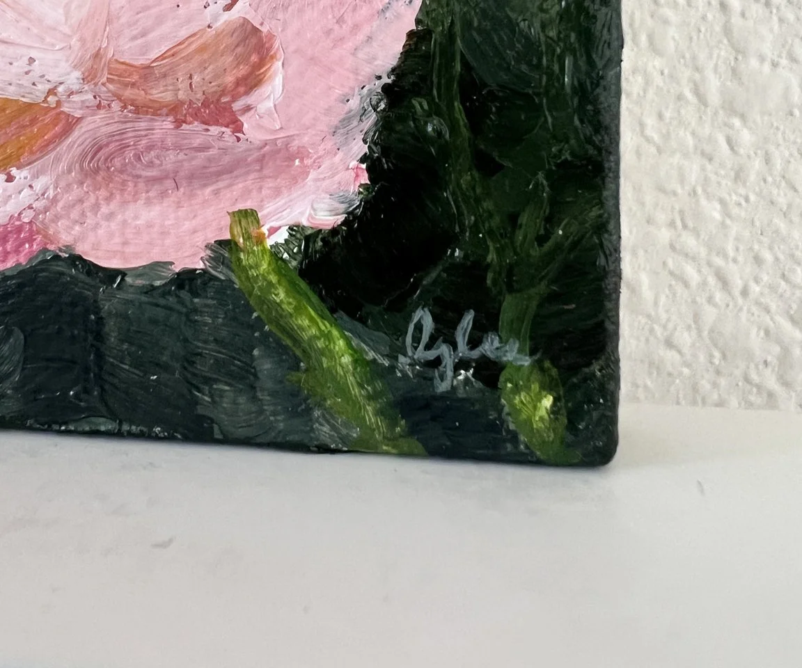 detail image of artist signature on green