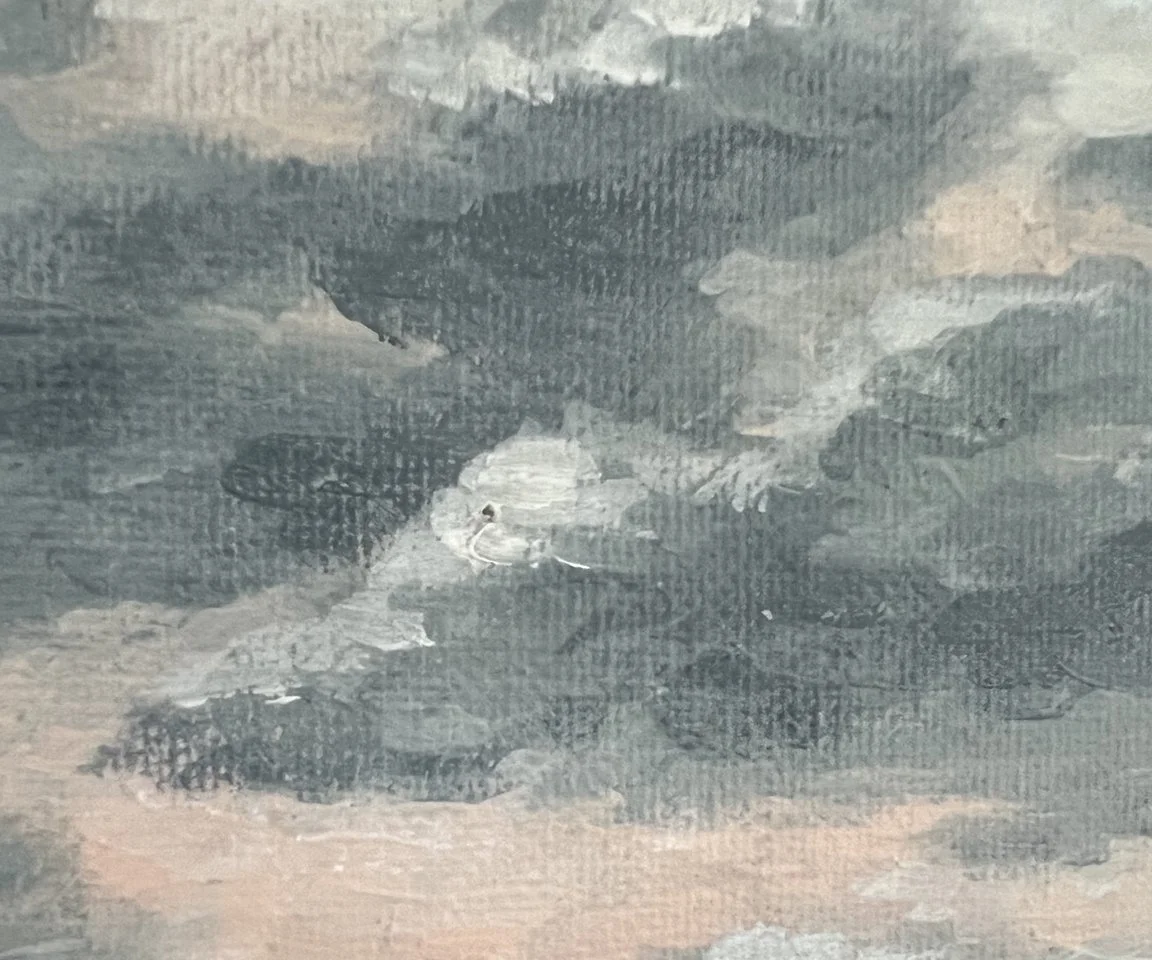 detail image of blue and white clouds in pink sky