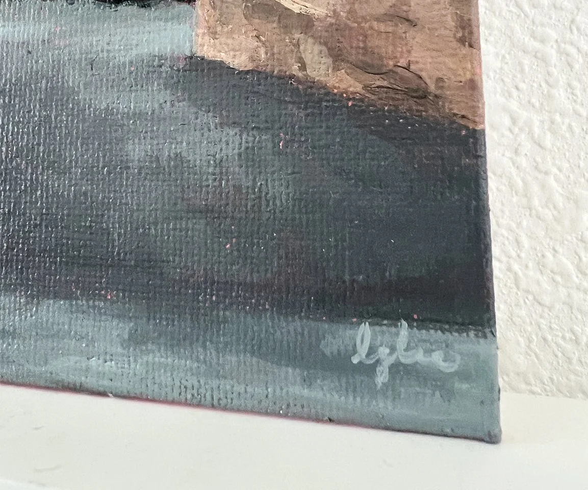 detail image of artist signature on gray