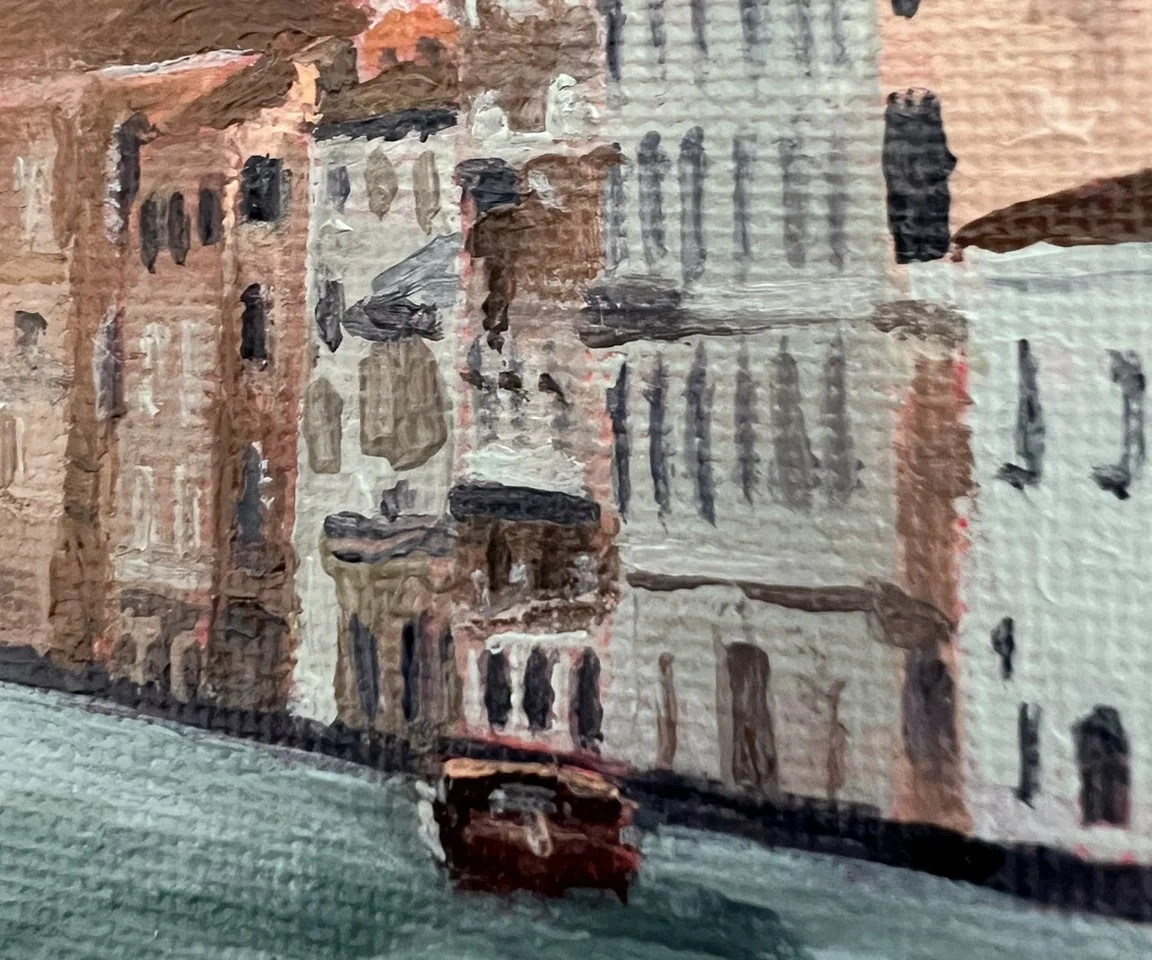 detail image of painted buildings and water