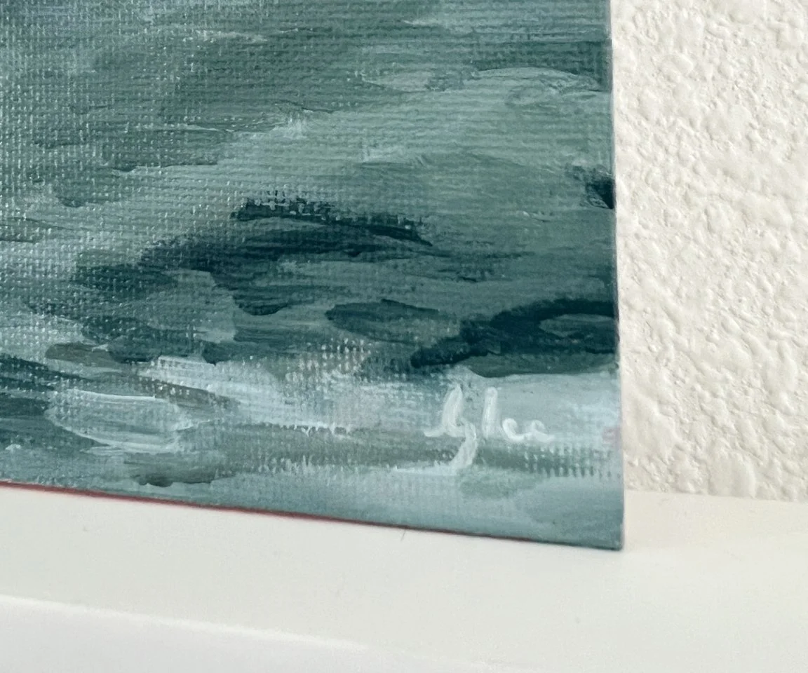 detail image of artist signature on green