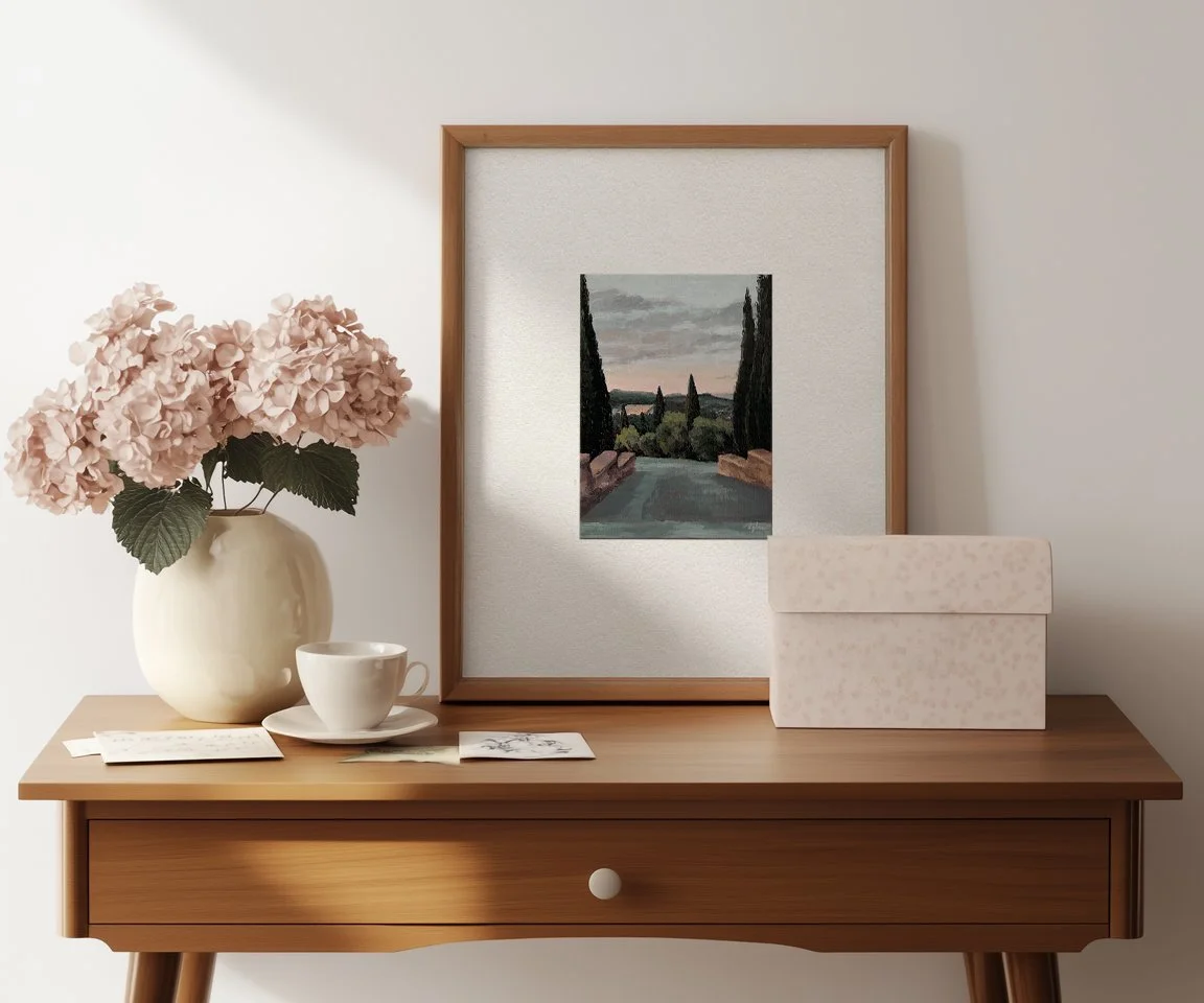 oversized frame with 5x7 sunset over Tuscany painting on desk