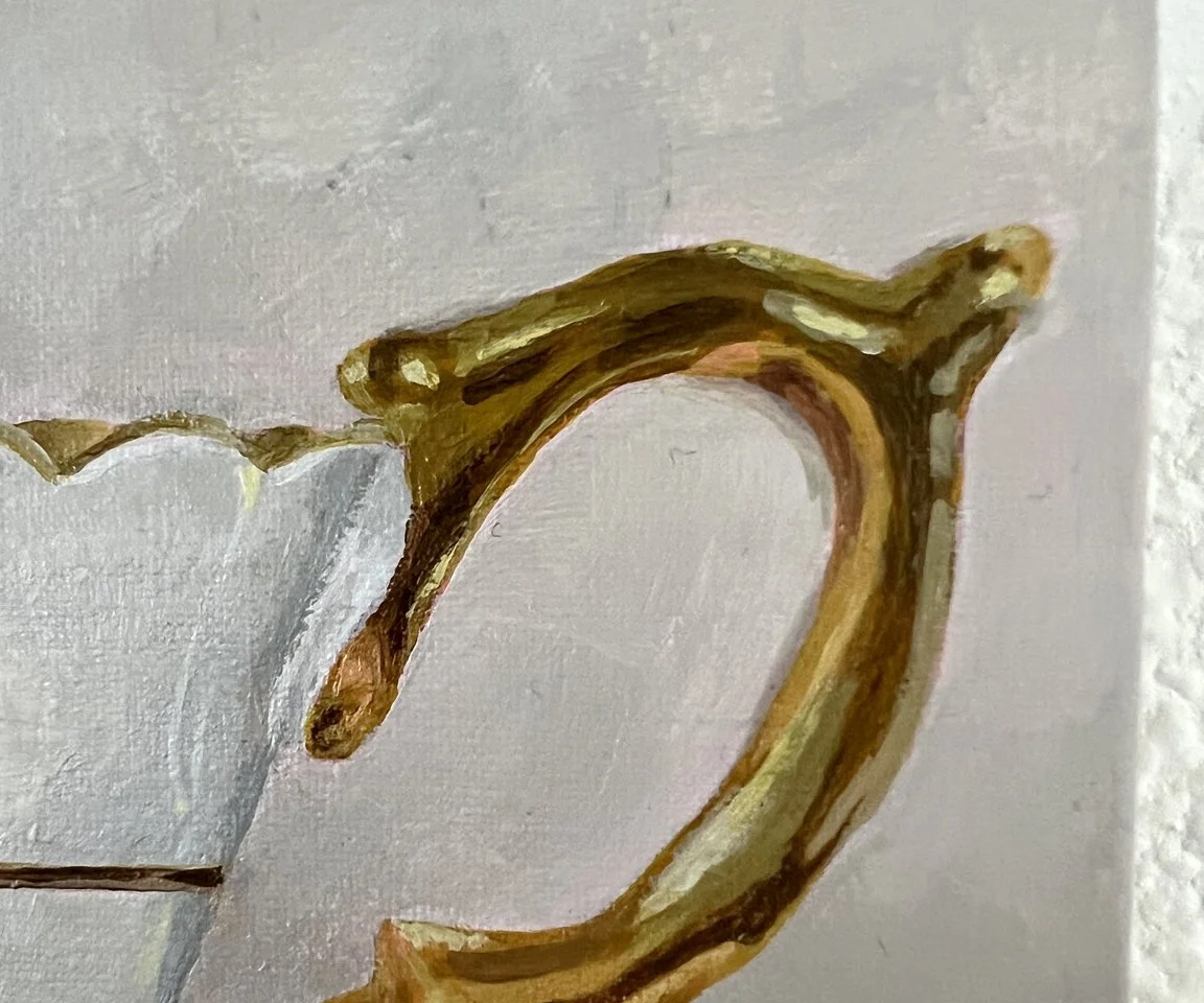detail of gold teacup handle