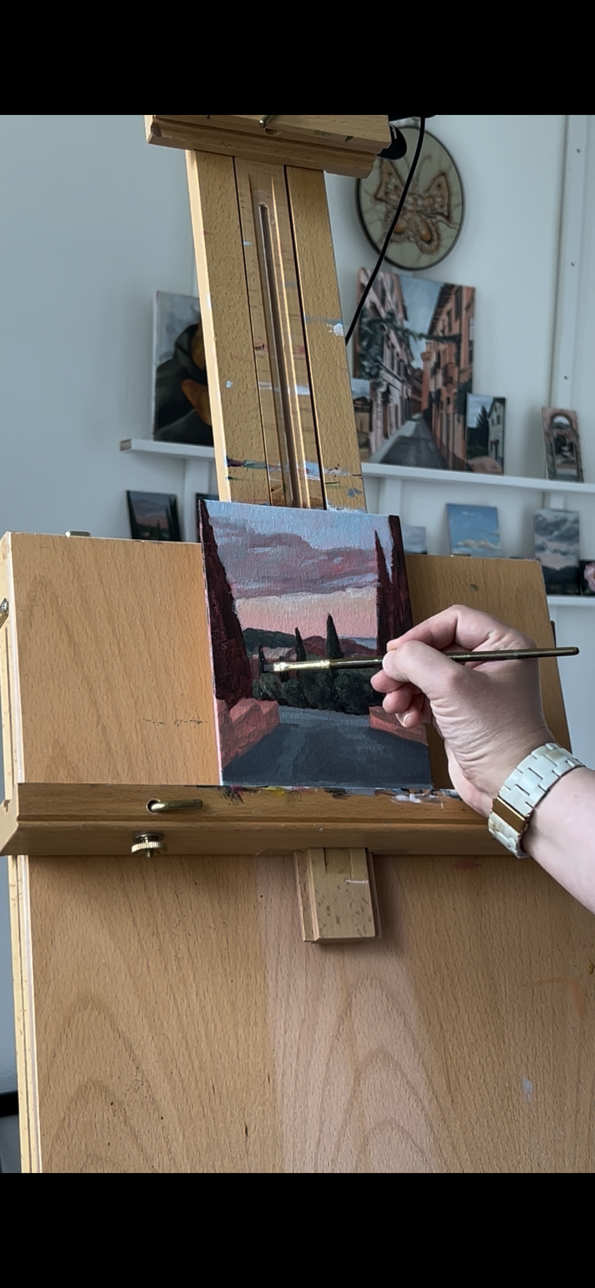 painting of Tuscan sunset in progress on easel
