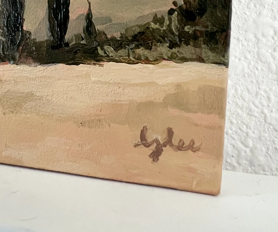 detail image of artist signature on gold