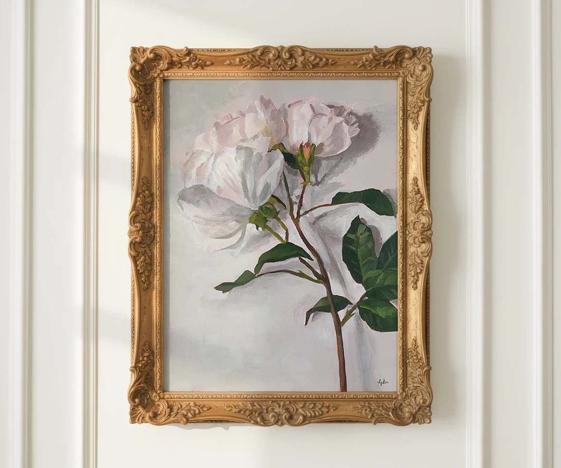 painting of roses in gold frame