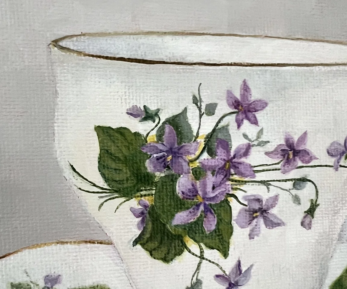 detail image of violets on teacup