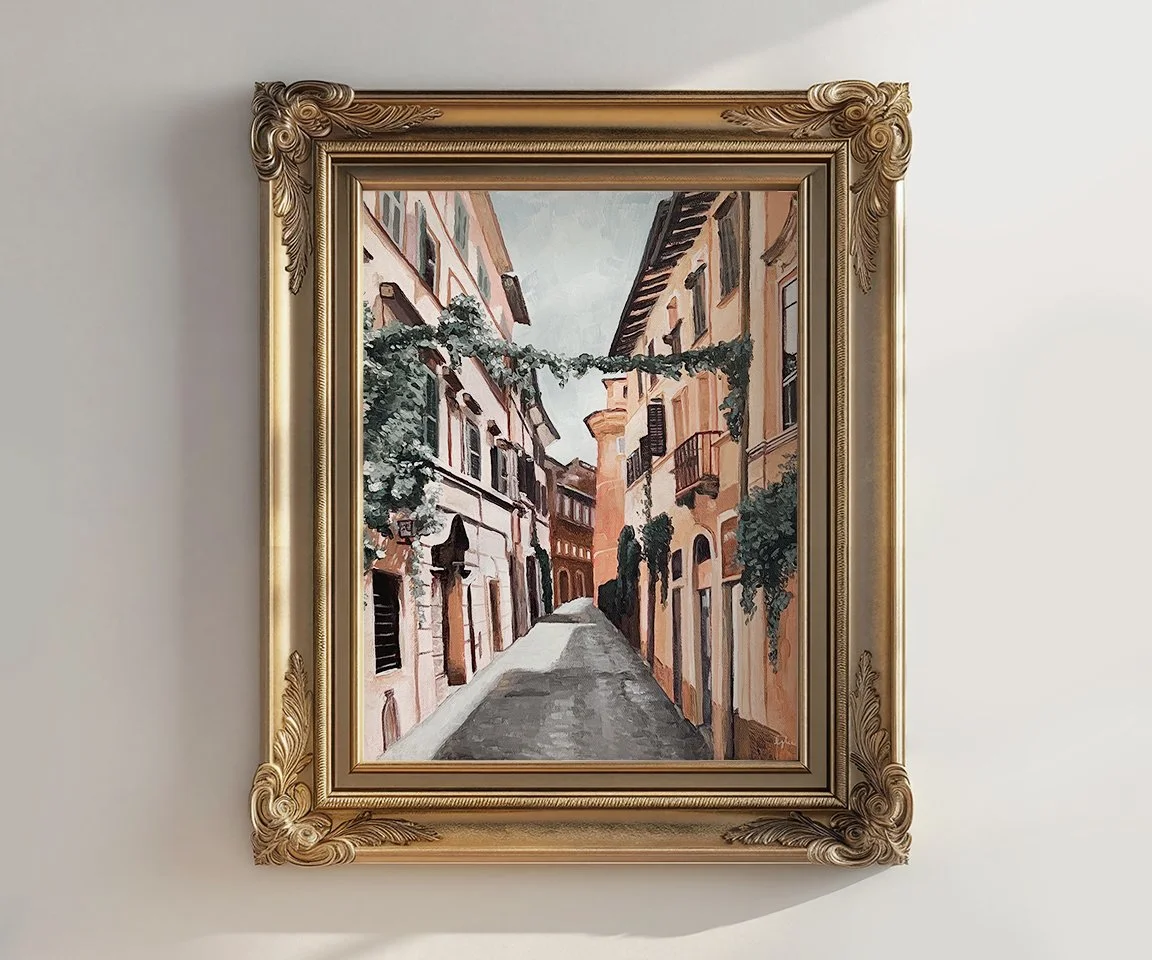 gold framed painting of street in Rome