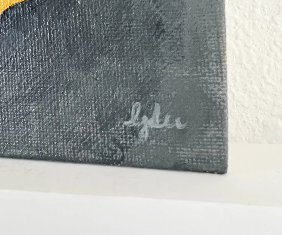 detail image of artist signature on gray