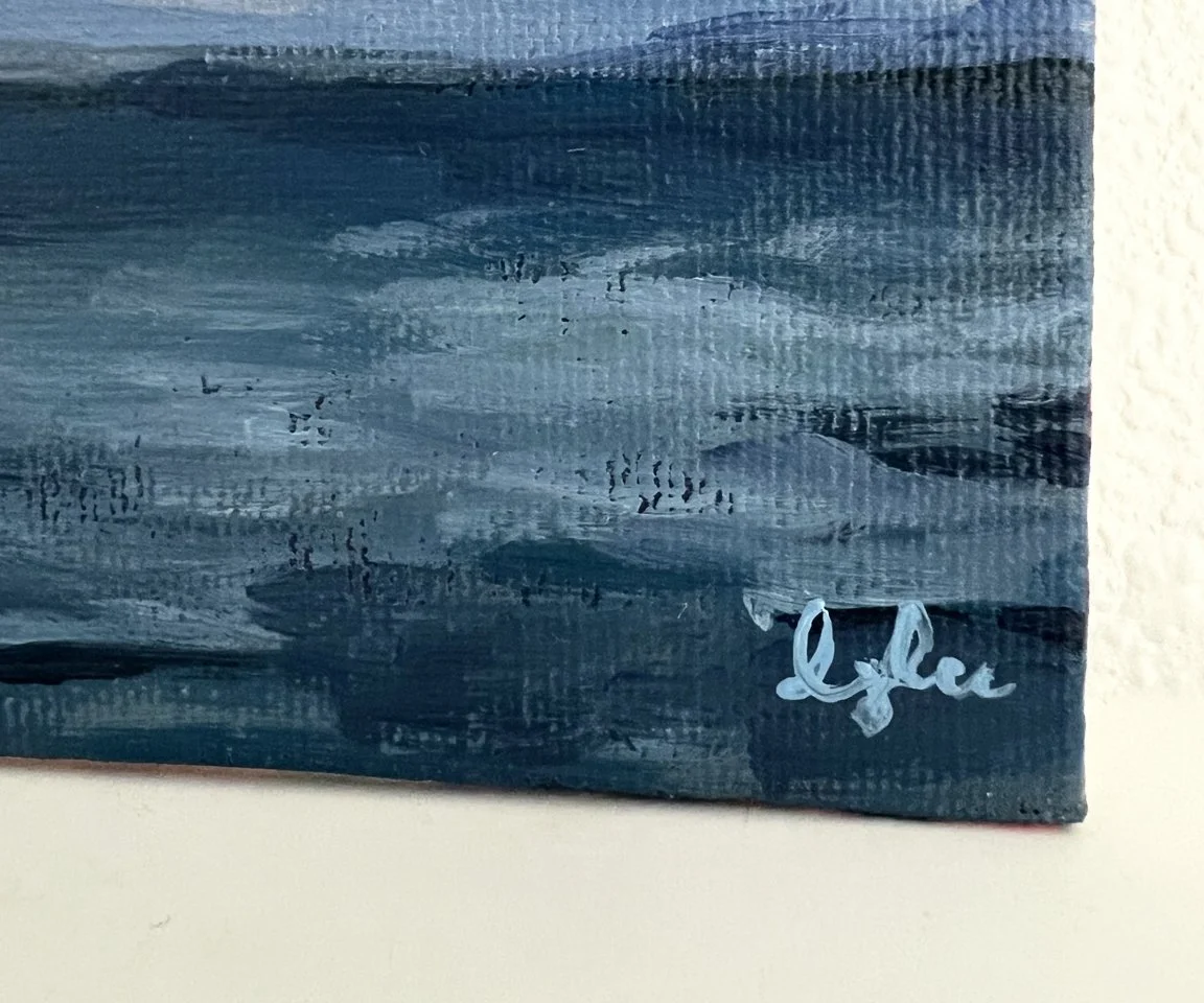 detail image of artist signature on blue ocean