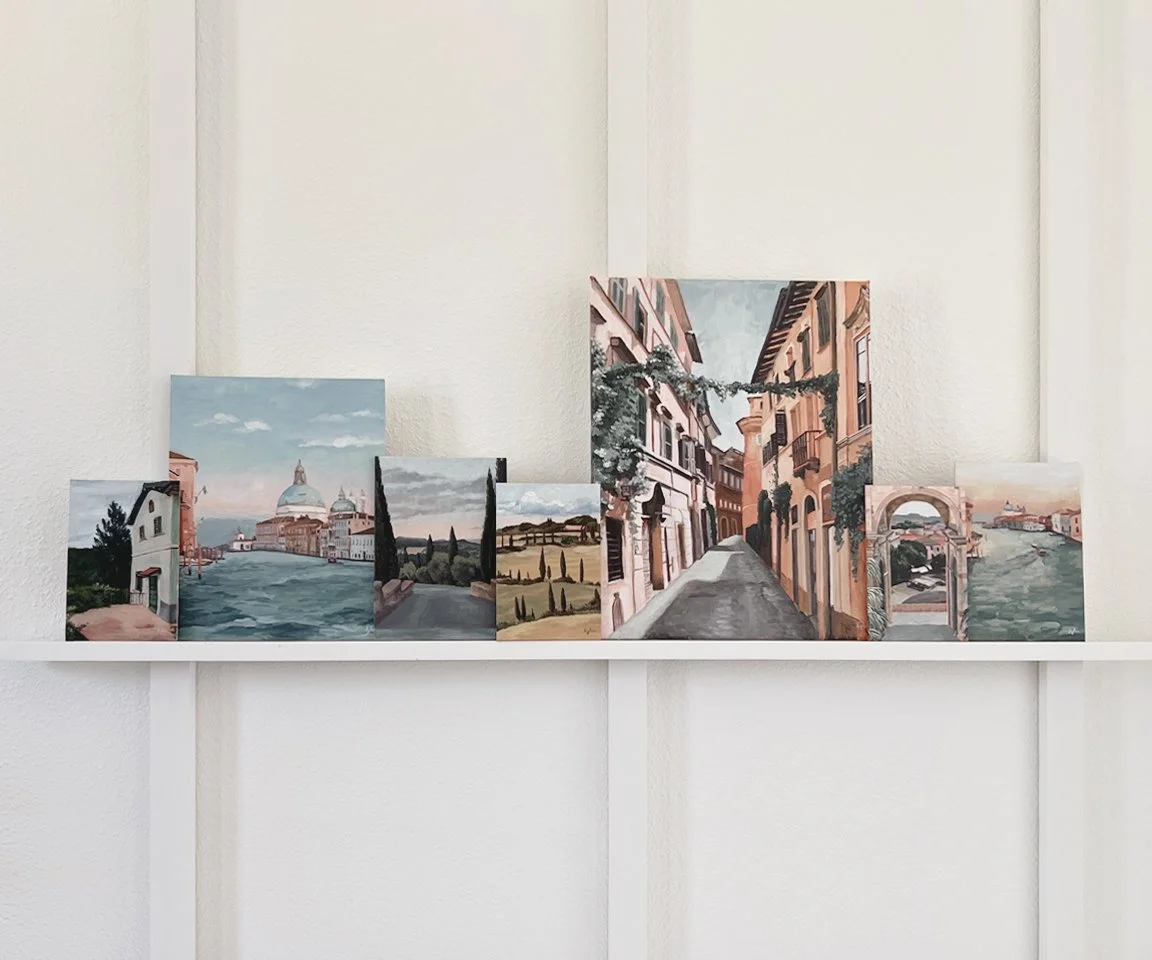 seven Italian landscape paintings on shelf