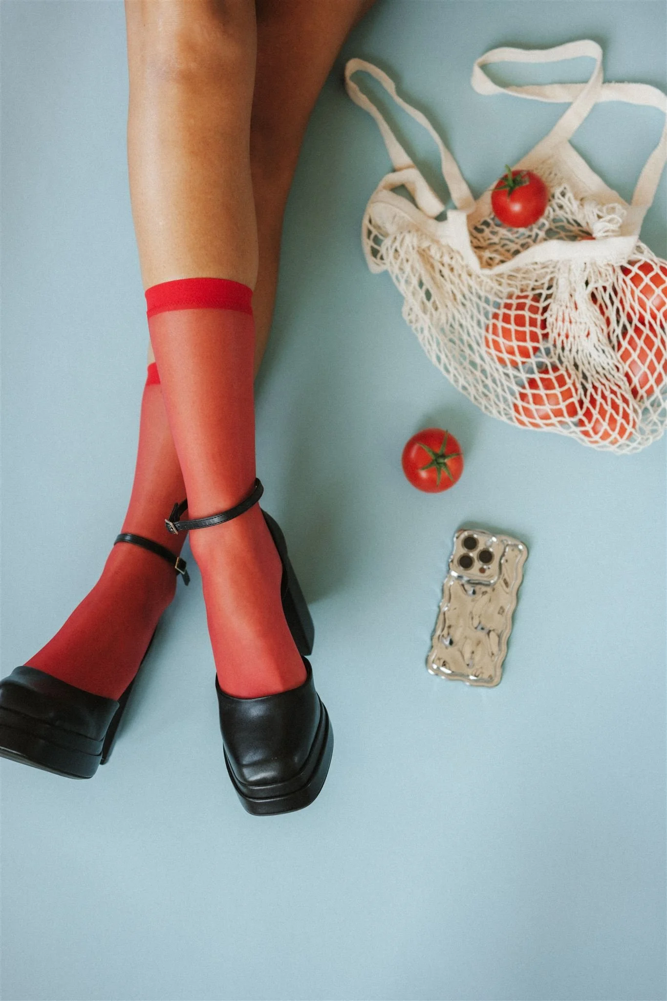  Red stockings, black heels, and tomatoes for a creative brand photoshoot in Kansas City.  