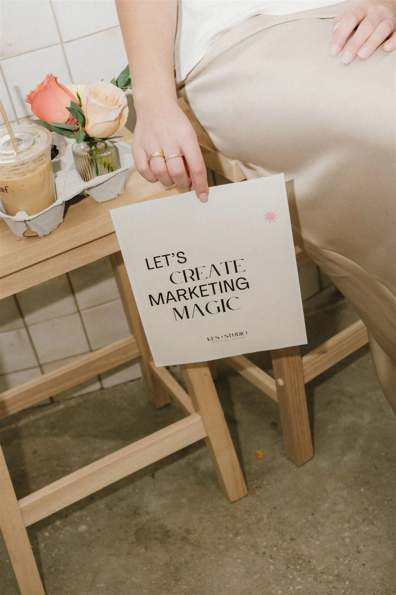  A woman holding a flyer for their business. 