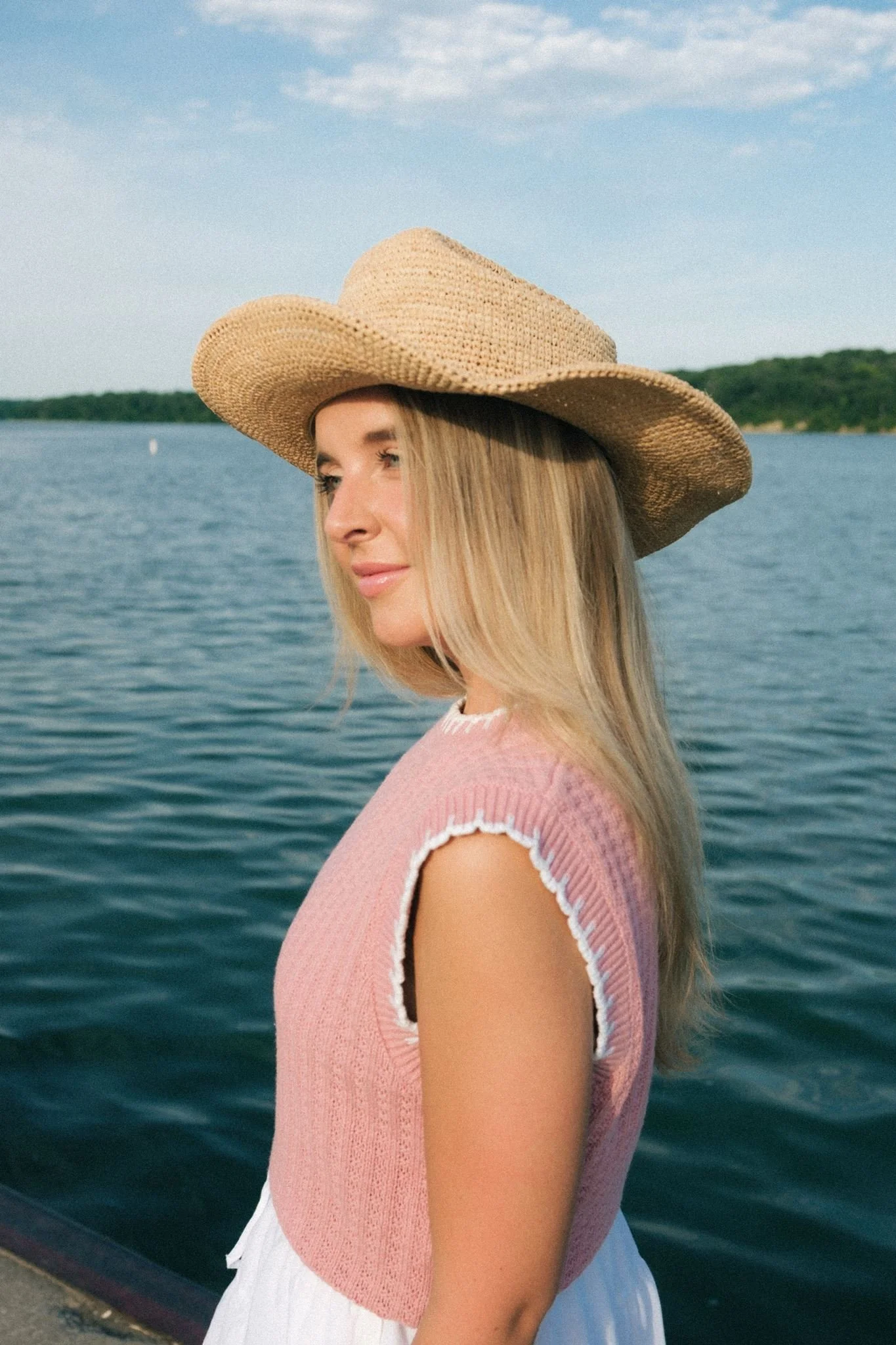  A woman looking out into the water during her brand photoshoot in Kansas City. 