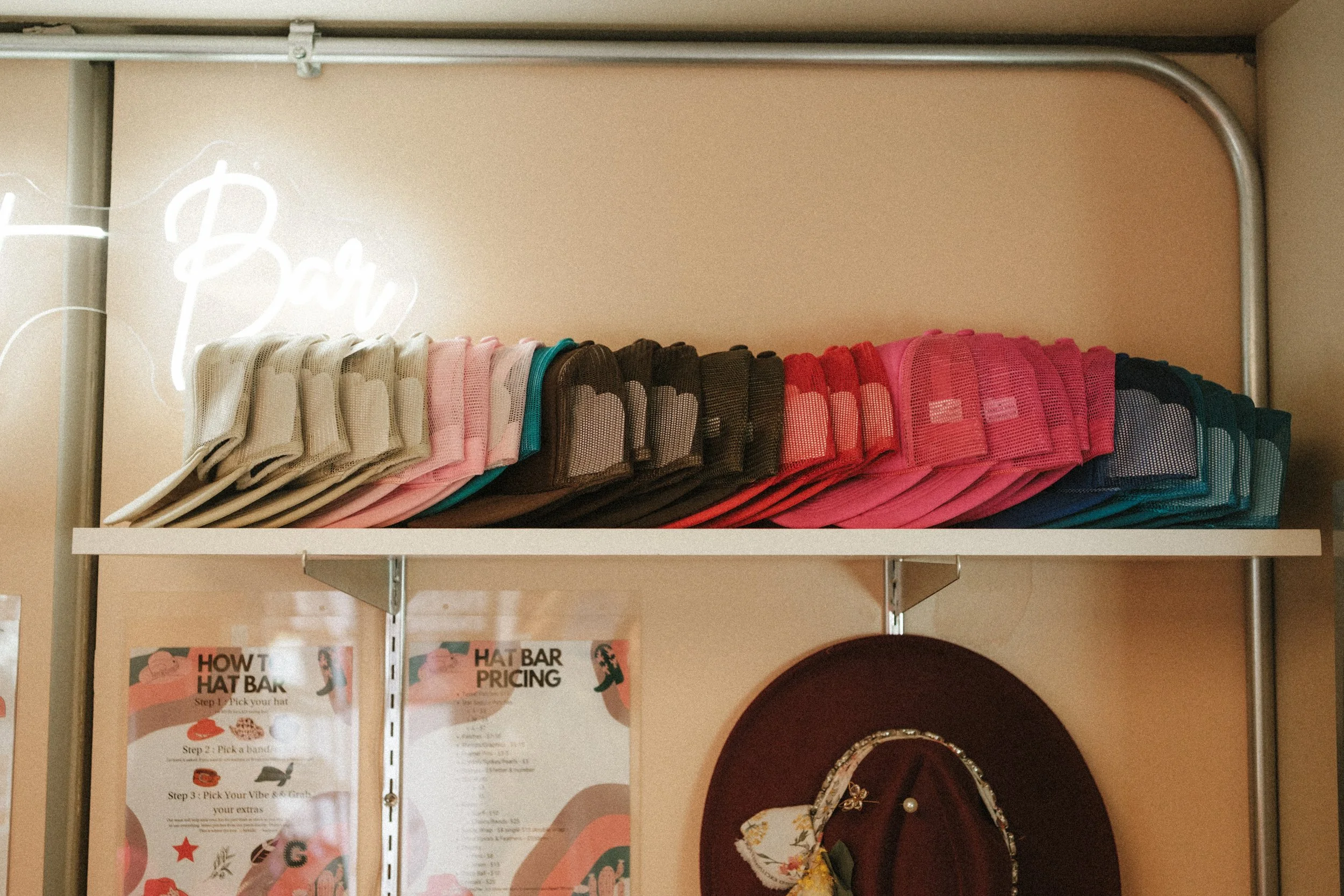 Brand photography of hats stocked in a store.