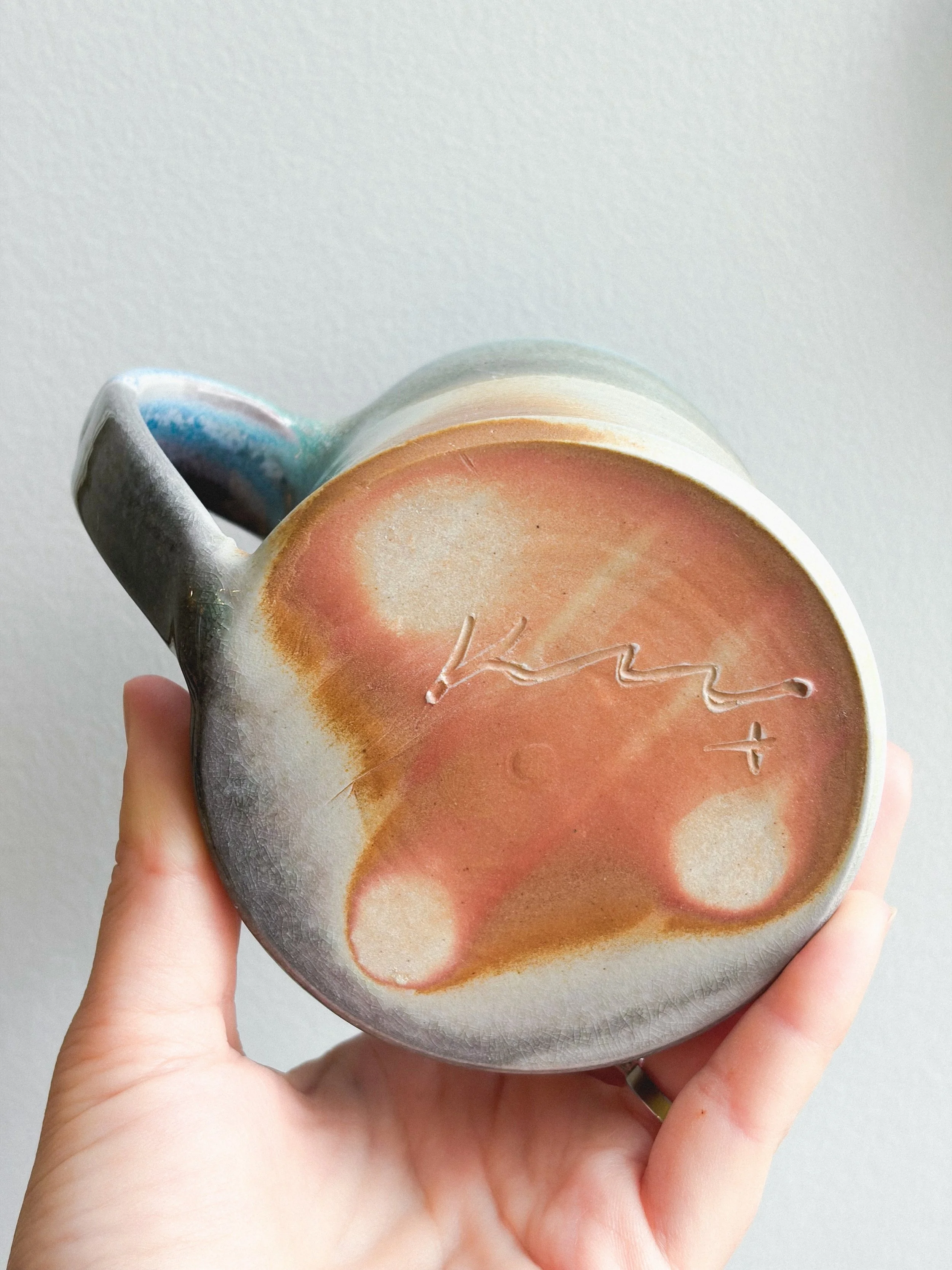 A little carbon trapping on this porcelain soda-fired mug.
One of three from the firing, with the bottom half left unglazed. I really love how the surface turned out on these, and I definitely didn&rsquo;t expect to be this attached to them. Might ha