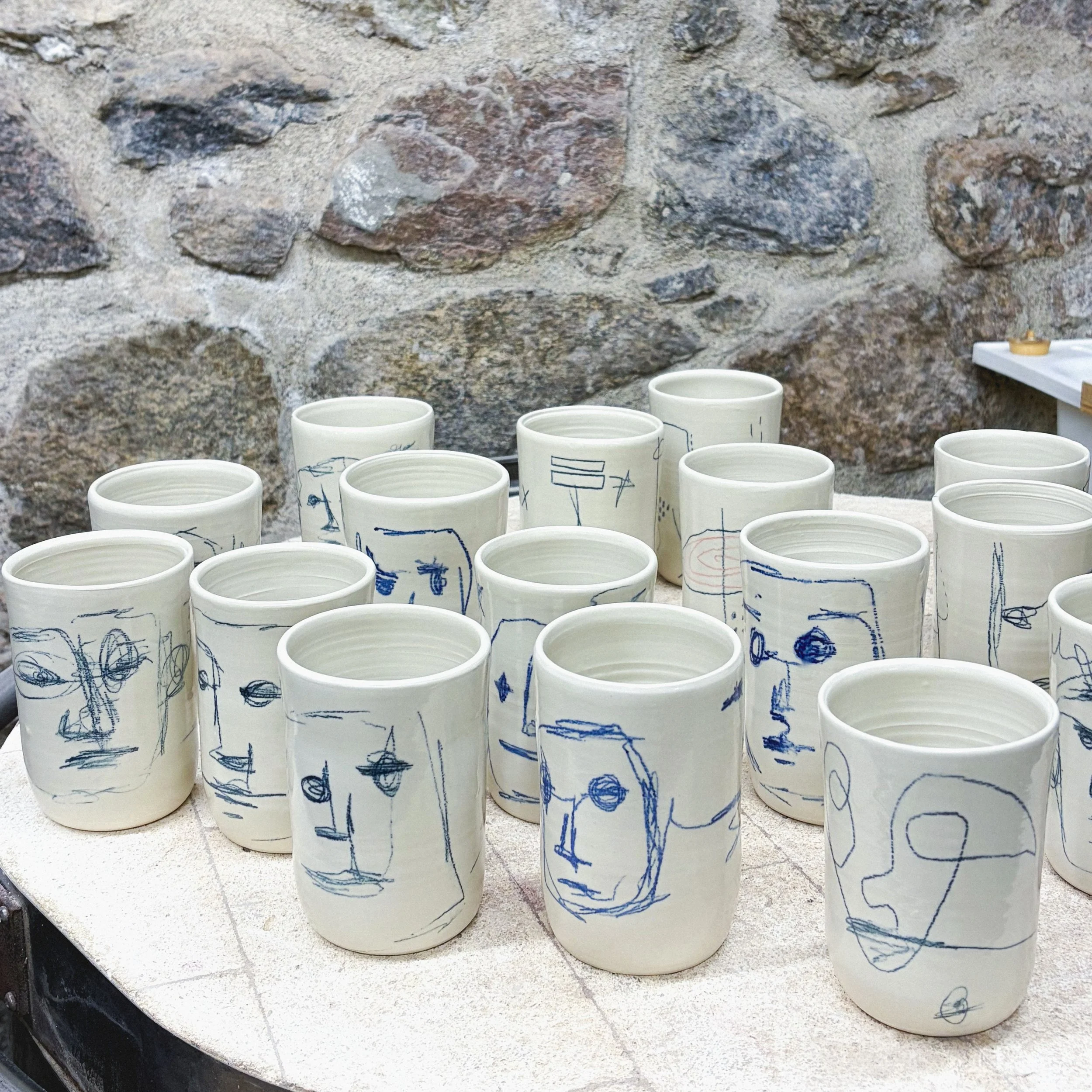 Some scribble people cups