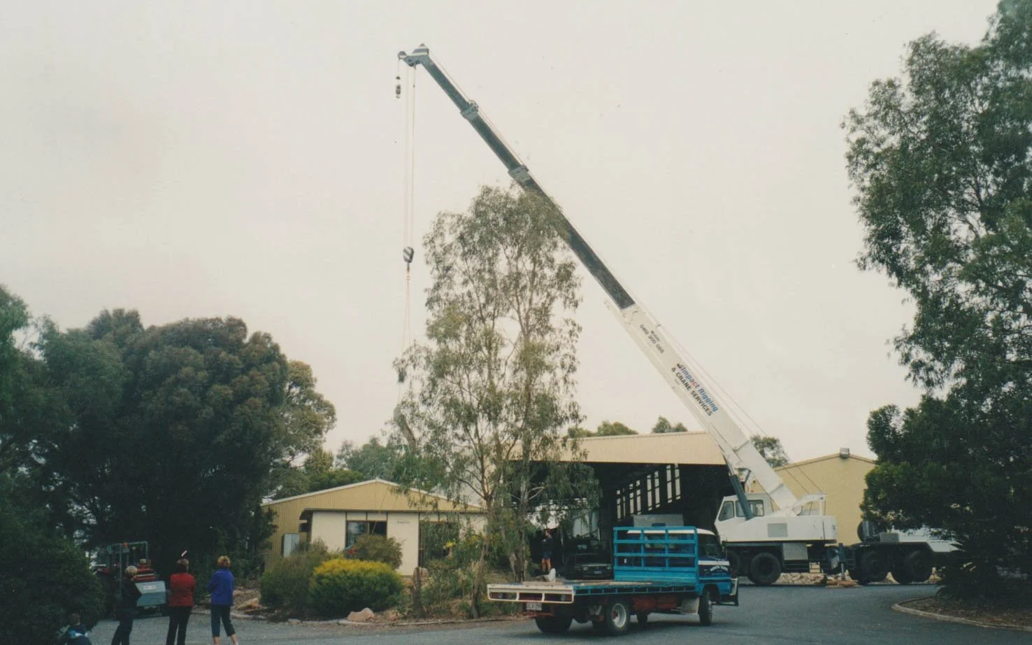 NT older office getting removed by crane, ready for the new office installation