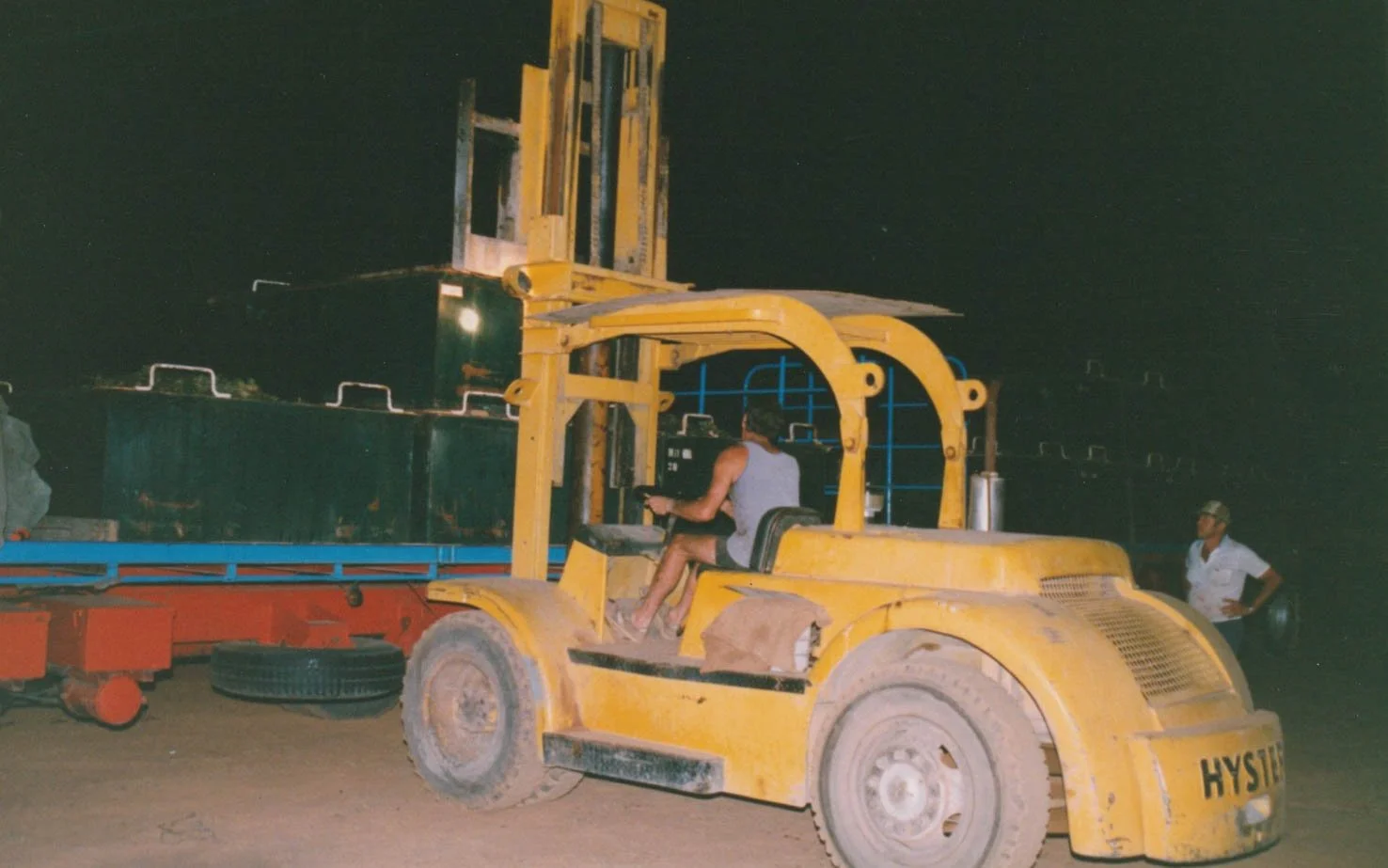 Kym Roocke loading a truck at night time