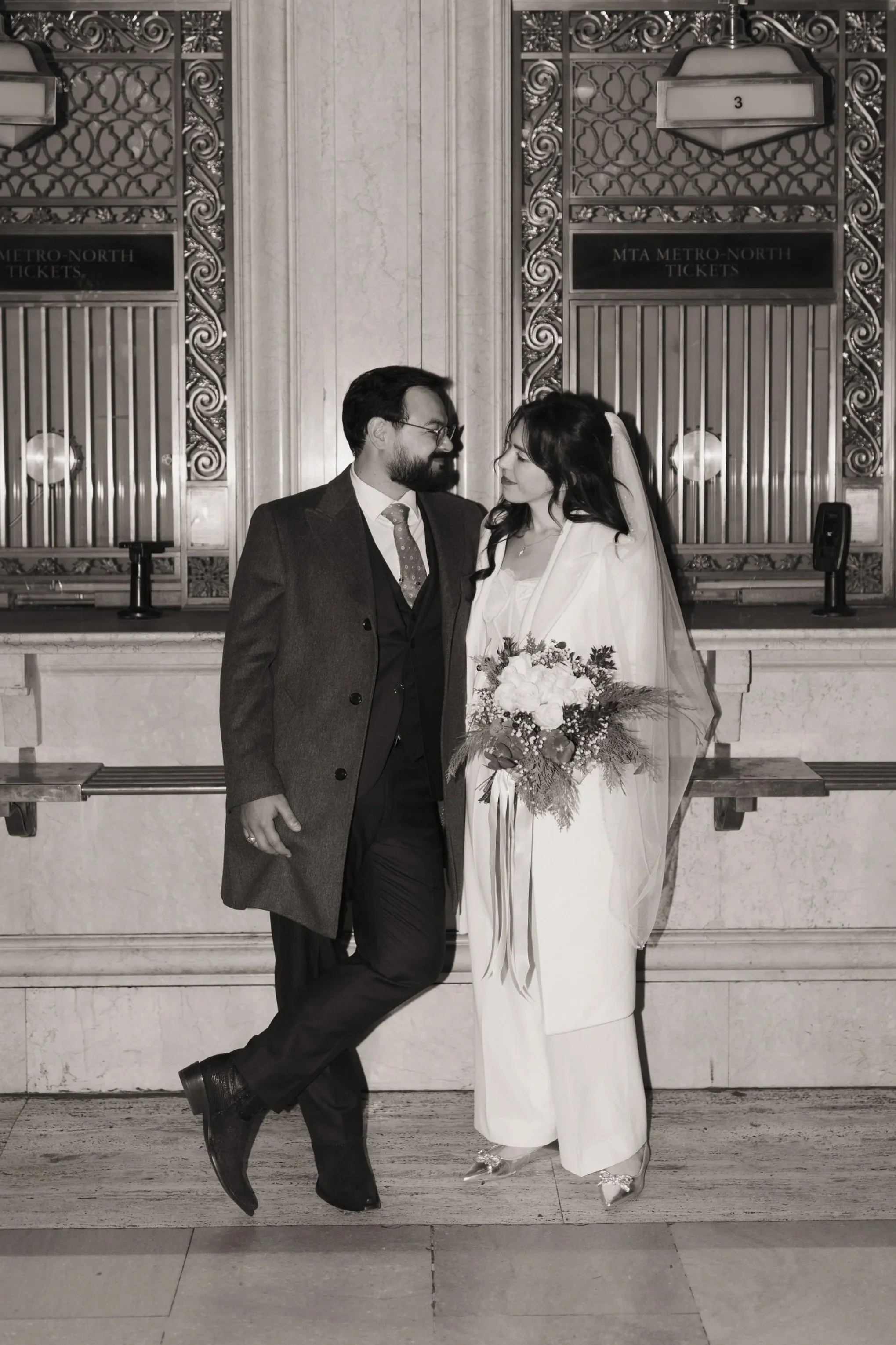 Human Resources Business Partner Consultant and Communications consultant Mazin Elia and Alex Elia looking at each other in a black and white photo in New York City, New York.