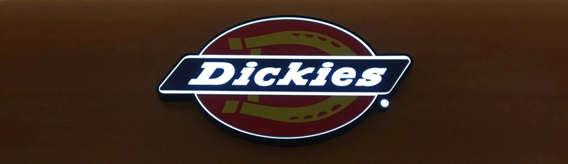 dickies logo sign lit up on wall