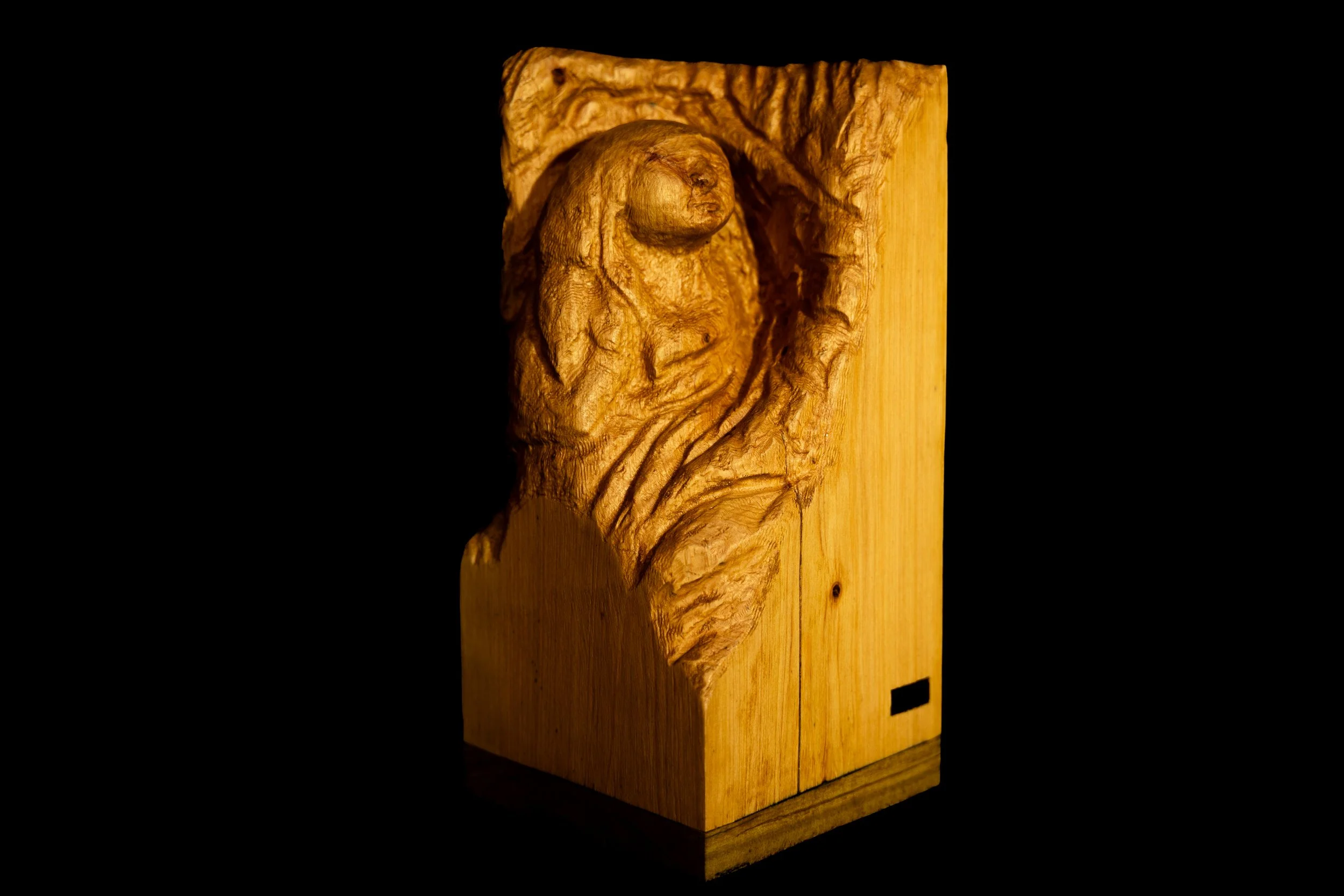 Cypress pine carving of a soulful woman upon awakening and connecting to herself.