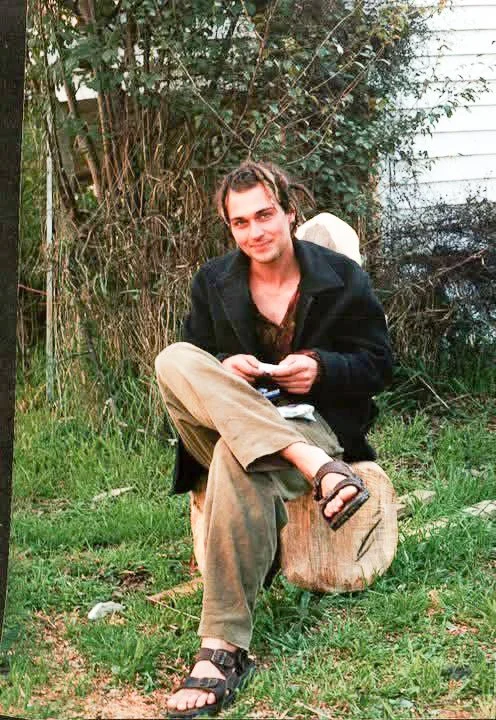 Young Sculptor David Puustinen rolls a cigarette. Being in the moment.