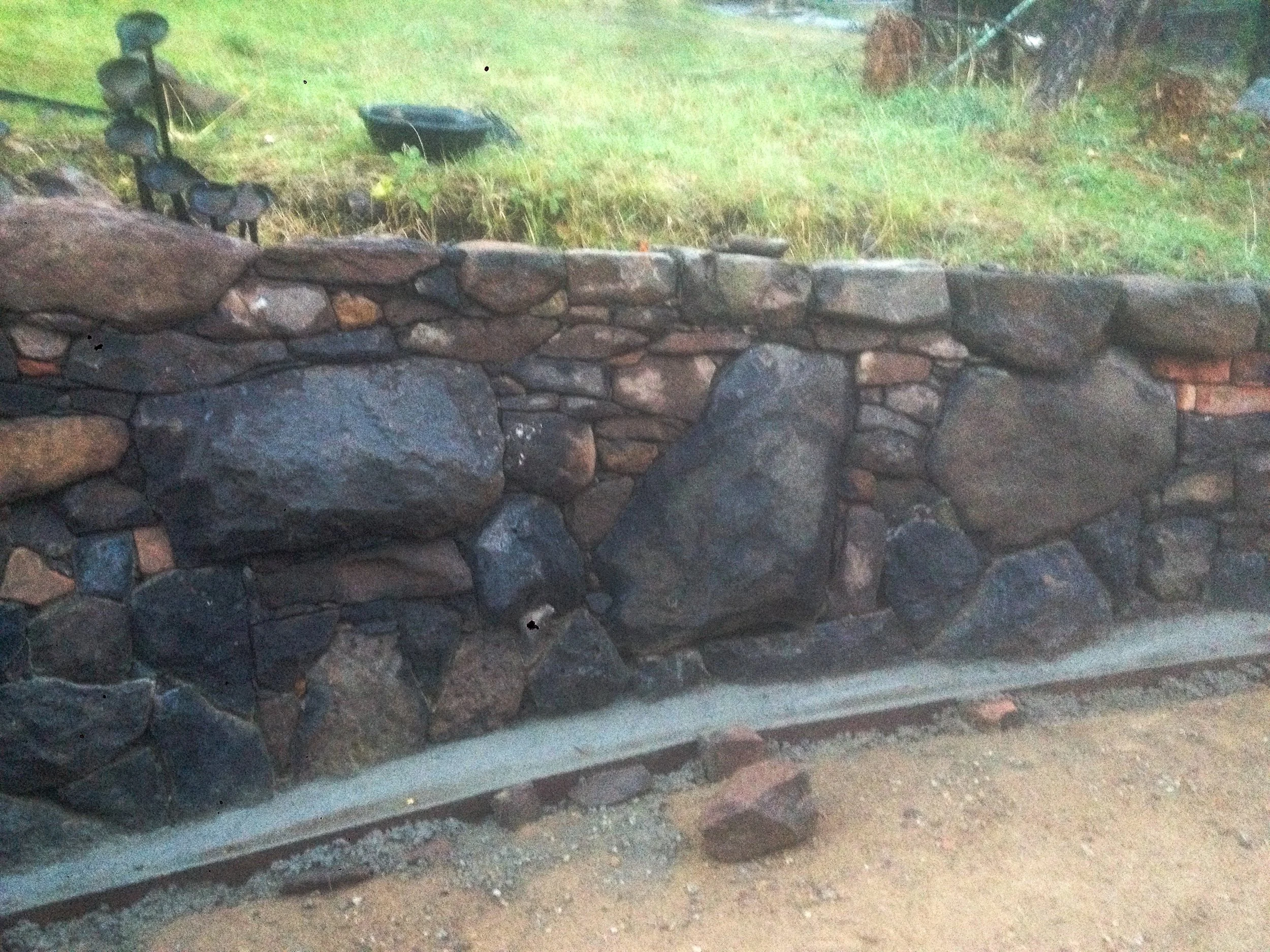 Stone work image of wall created by David Puustinen and Paul Roadknight. Concept by Ian Desilva.