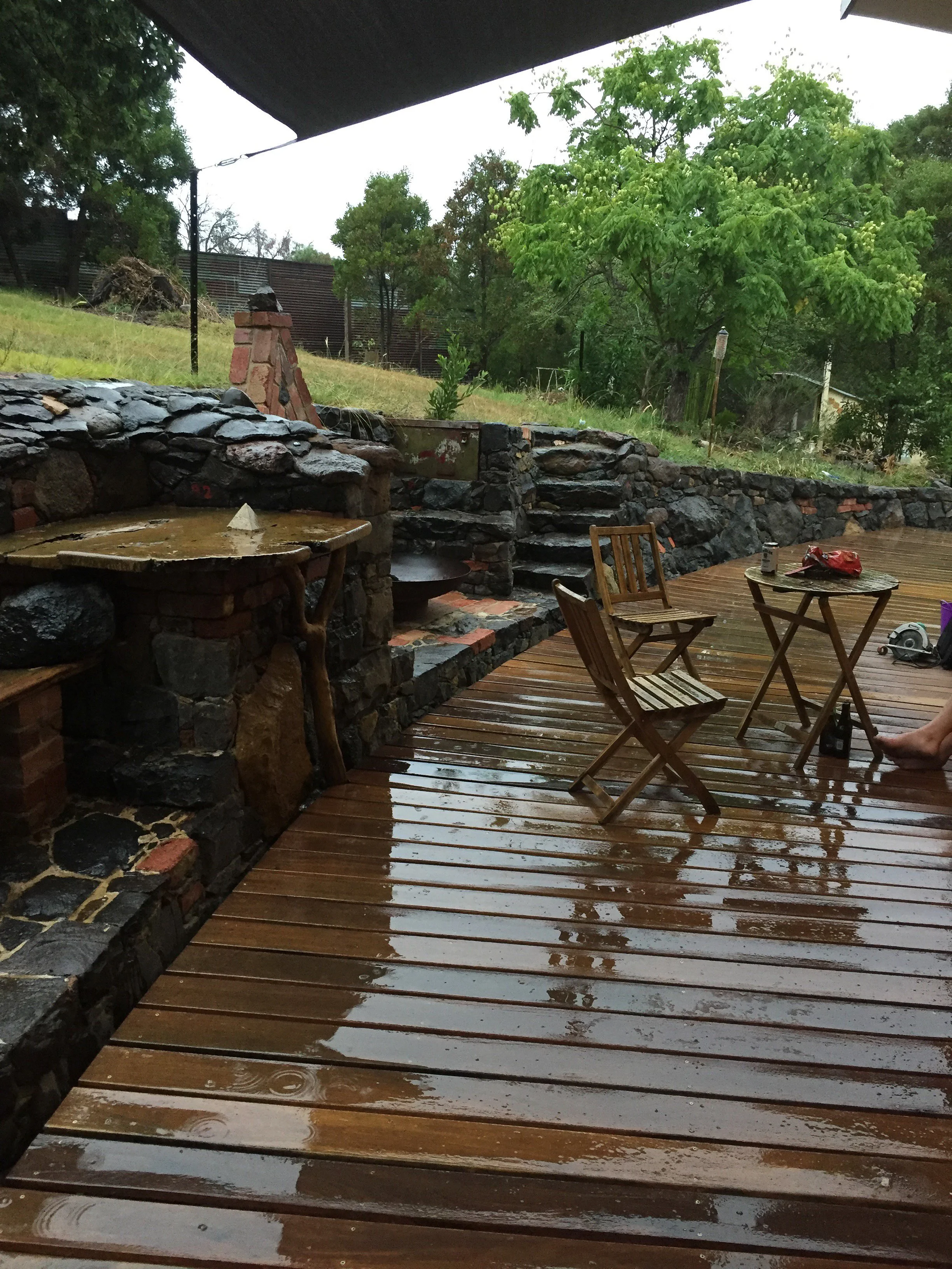 Stone work meets timber decking. Stone masonry by David Puustinen and Paul Roadknight