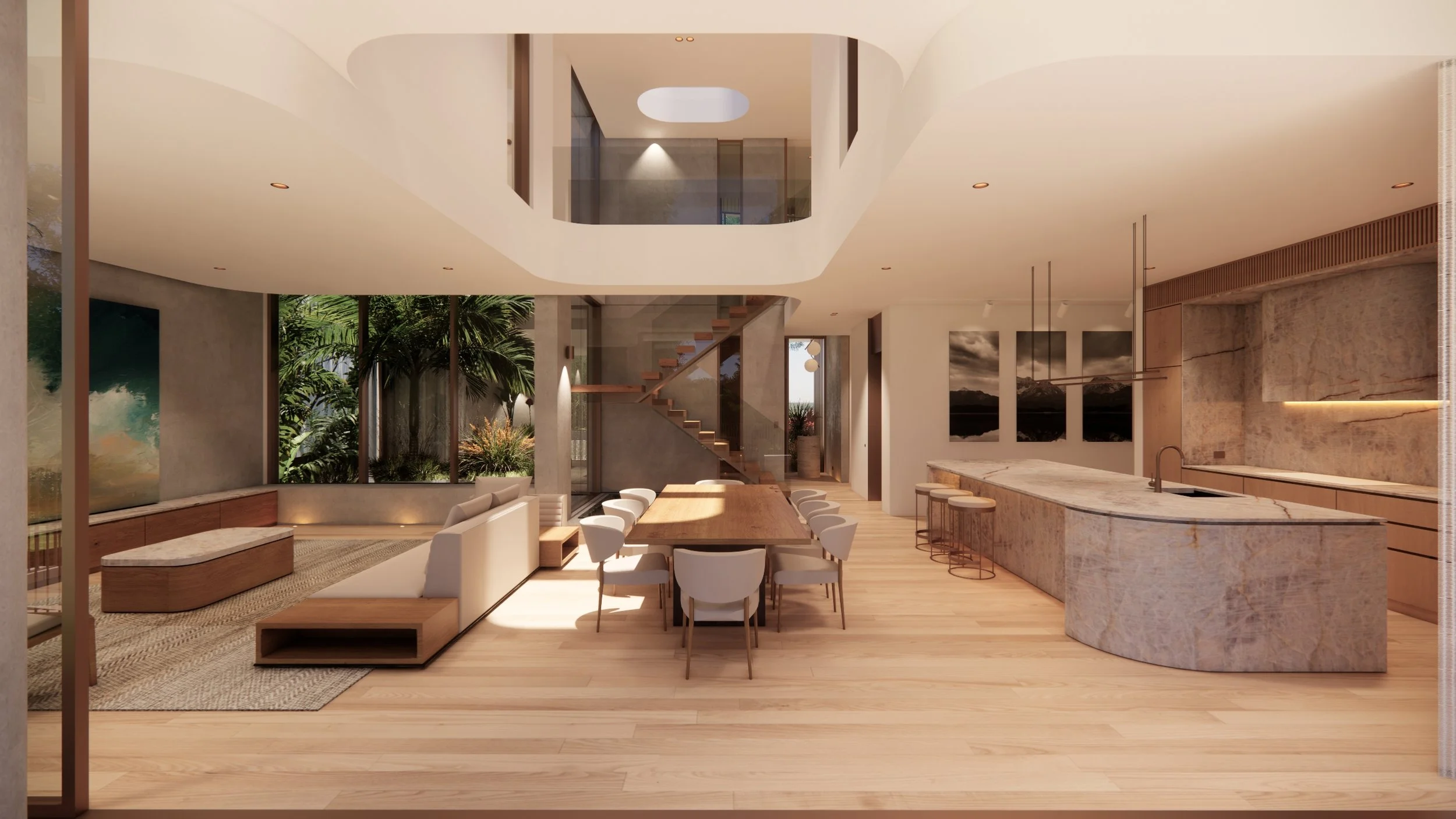 Open concept living and kitchen area with modern decor, large windows showing greenery outside, a staircase with glass railing, a dining table with chairs, and a curved marble kitchen island.