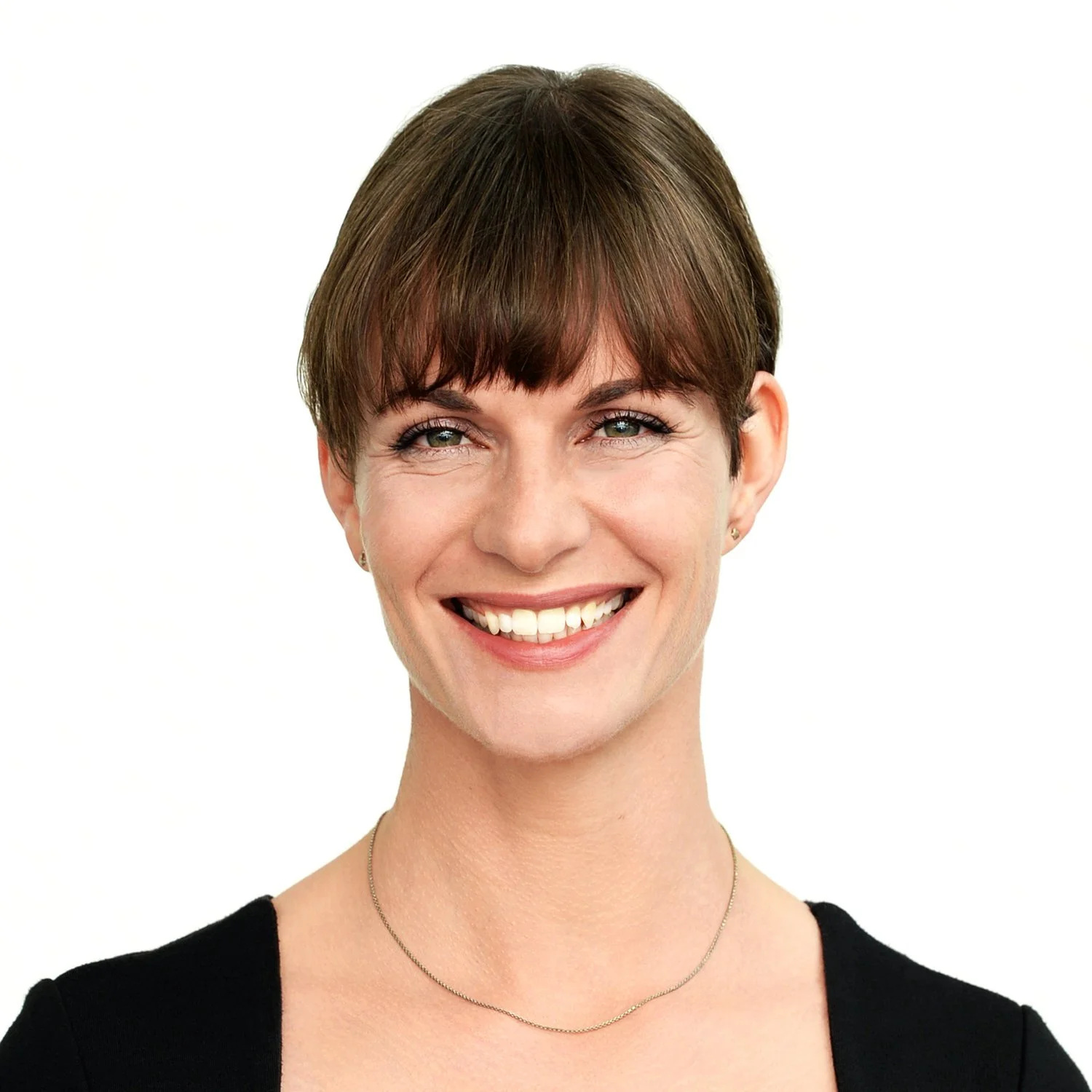 Portrait of a woman with short brown hair, smiling, wearing a black top and a thin silver necklace.