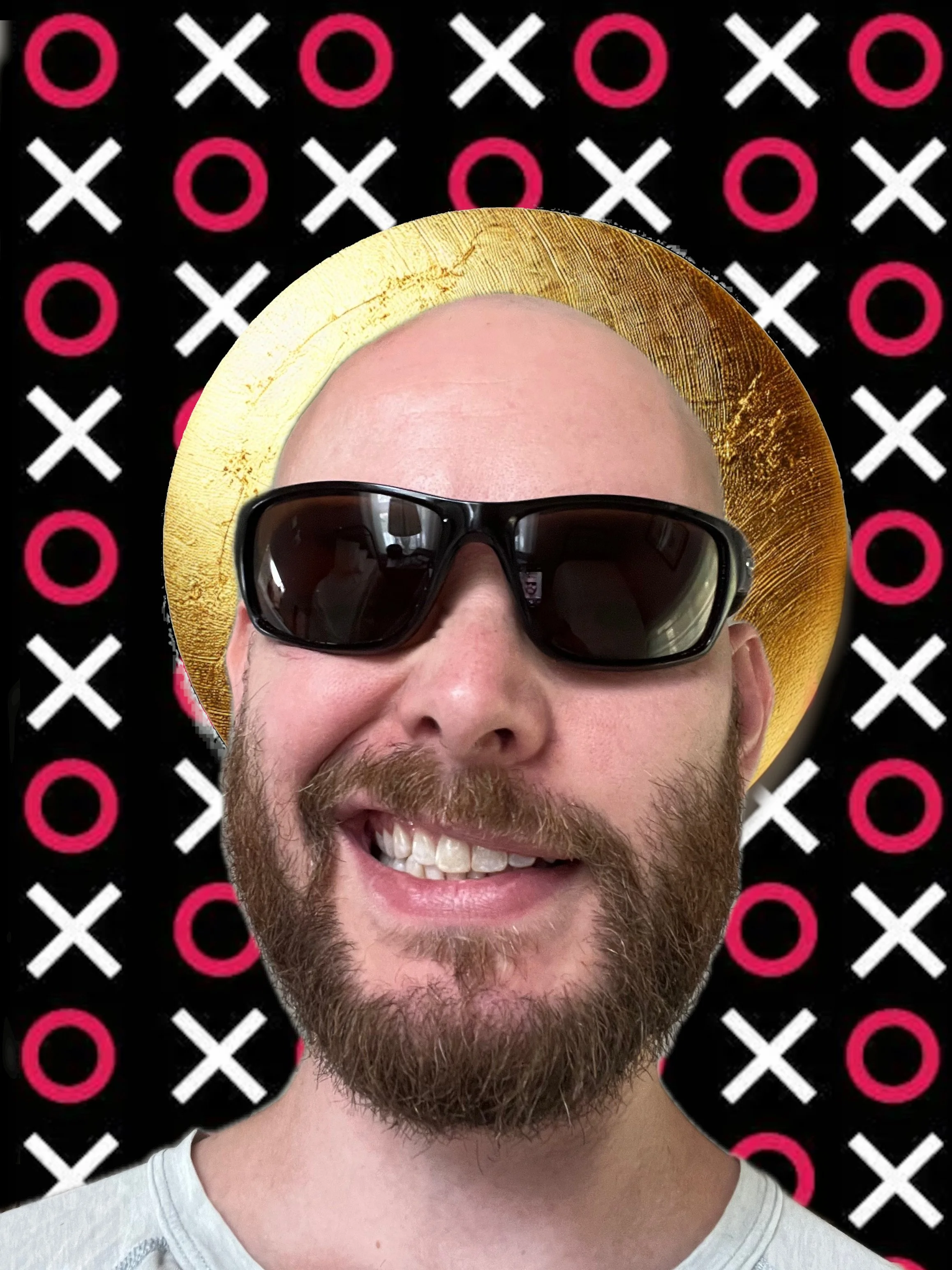 A man with a beard wearing sunglasses and a golden halo in front of a black background with pink and white X's and O's.