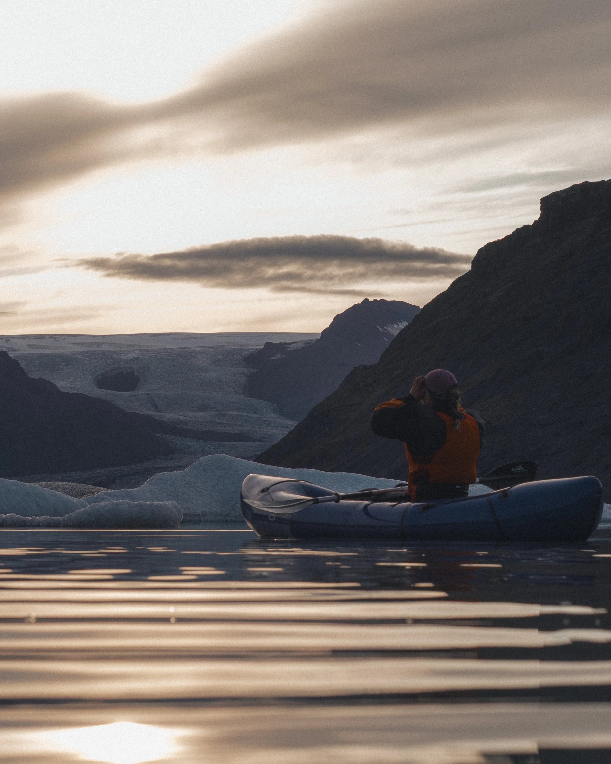 Kayaking at a sunset next to the glacier