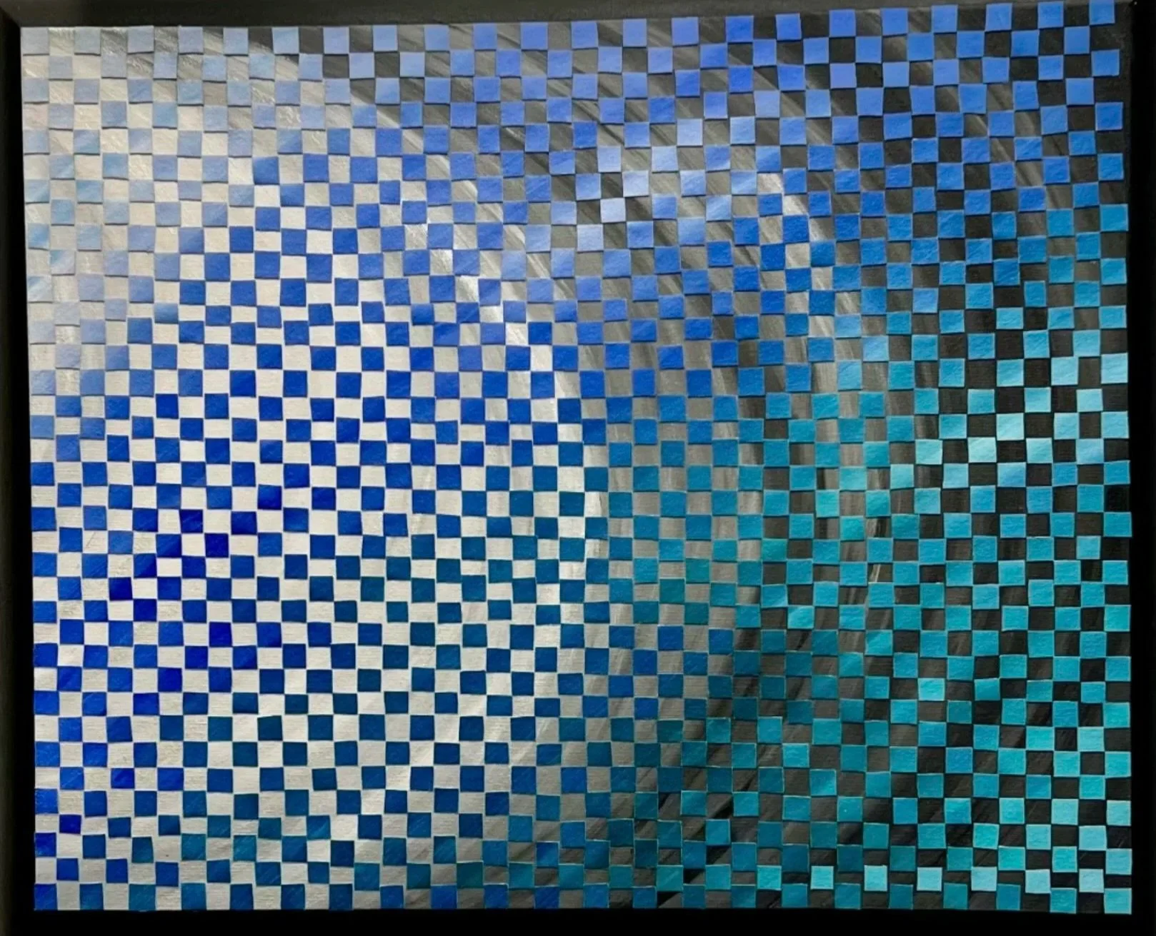Optical illusion image of a checkered pattern with distortion and color shift from blue to cyan to black.