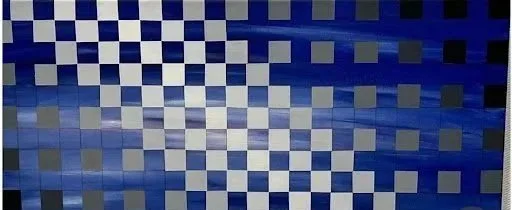 A geometric pattern of blue and white squares arranged in a checkerboard-like design.