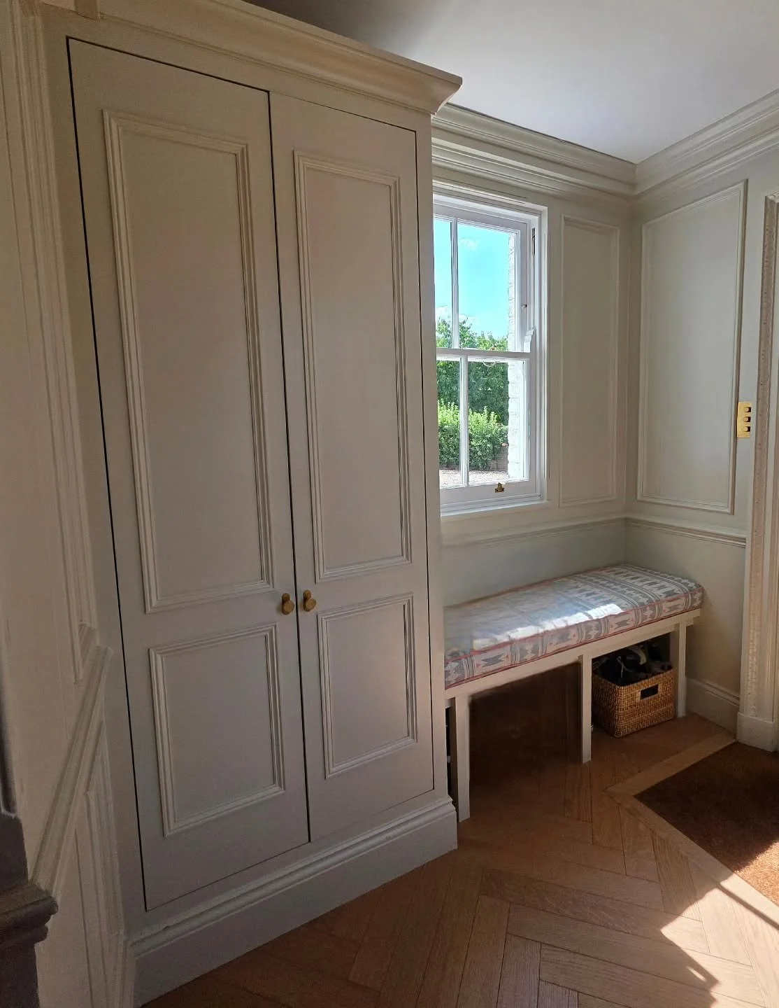 A lovely bespoke shoe cabinet we recently fitted &mdash; the moulding on the doors lines up perfectly with the wall panelling for a clean, classic look. The coving and skirting add to the traditional feel of this country cottage entrance hall. Finish