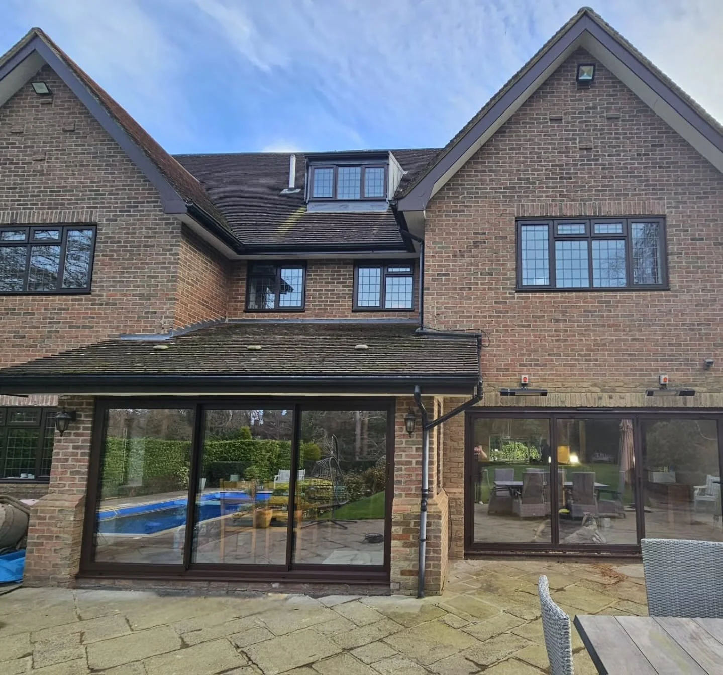 We installed a structural steel beam to open up this space and added gorgeous bifold doors to bring in tons of natural light. The result? A seamless flow between indoors and out &mdash; perfect for relaxing, entertaining, and enjoying the garden year