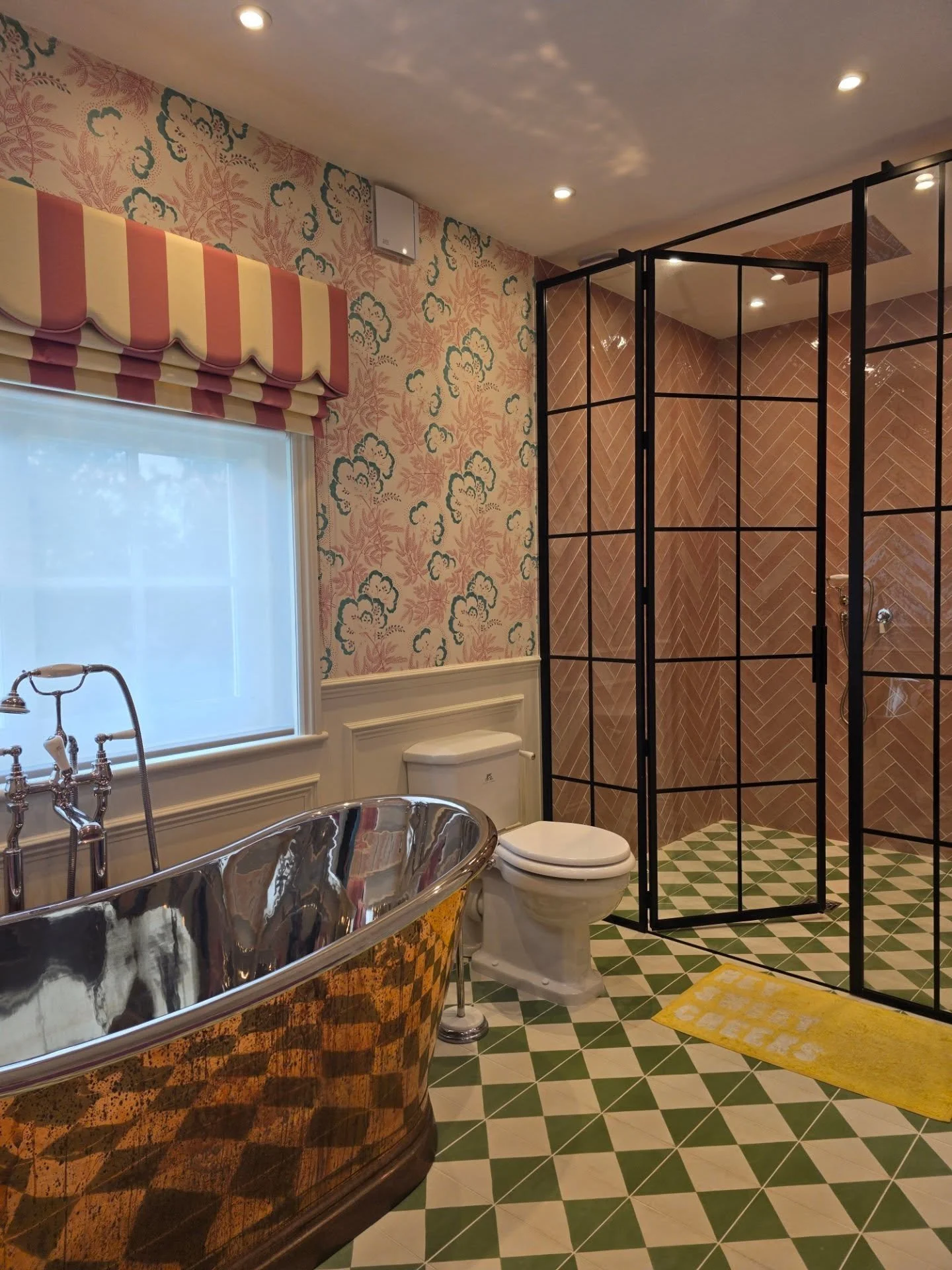 GRAPHENE completed this entire home, and the master bathroom is all about making a statement. Designed by @summerfield_interiors , the bold geometric floor tiles to the playful wallpaper and bright pink vanity, every detail brings personality and sty