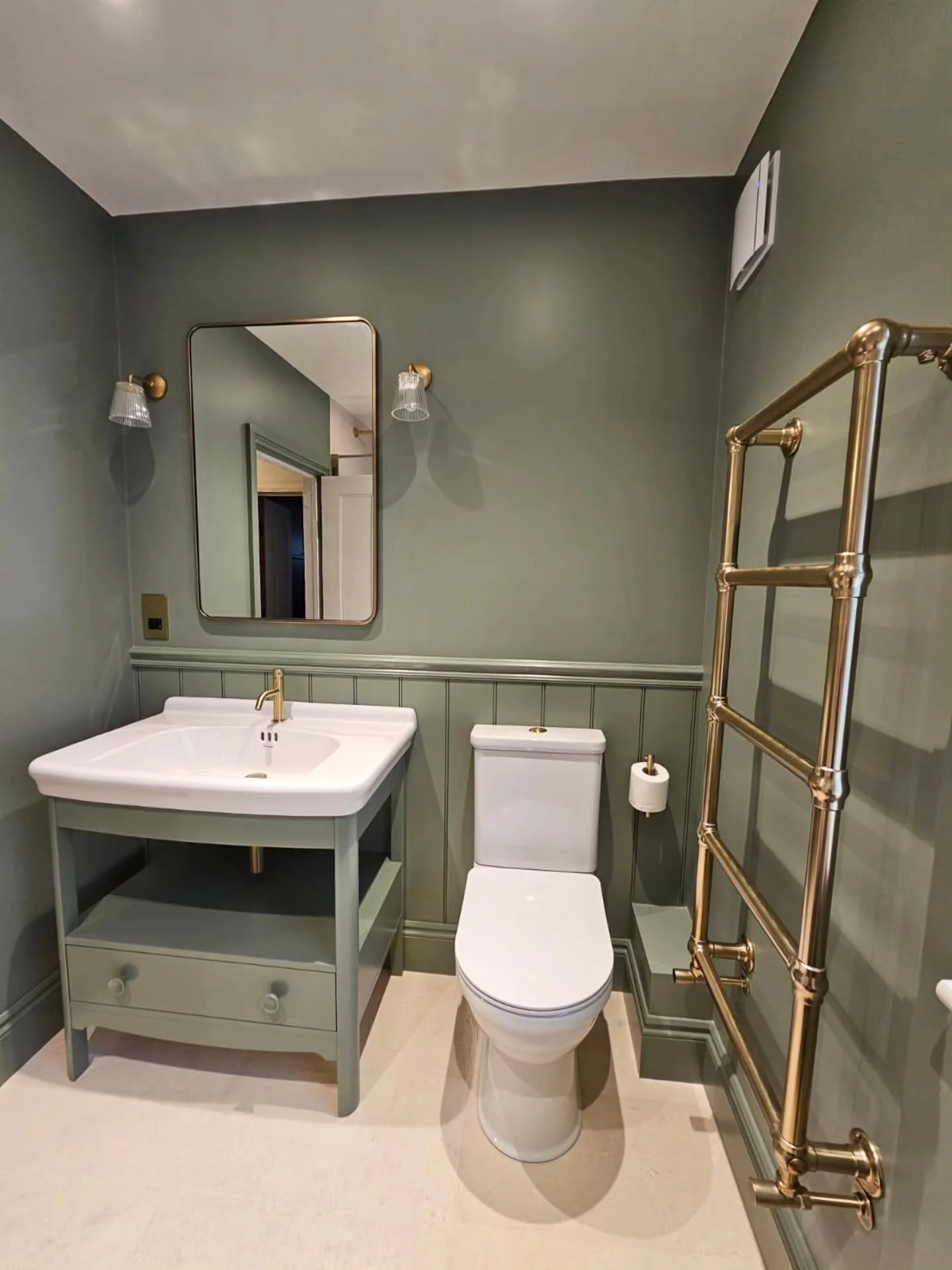 Bathroom goals 

A calm, elegant space &mdash; sage green walls, brushed brass accents, and that perfect blend of modern and classic. The gold taps add just the right touch of luxury, while the soft tones keep it feeling super serene. Part of a full 