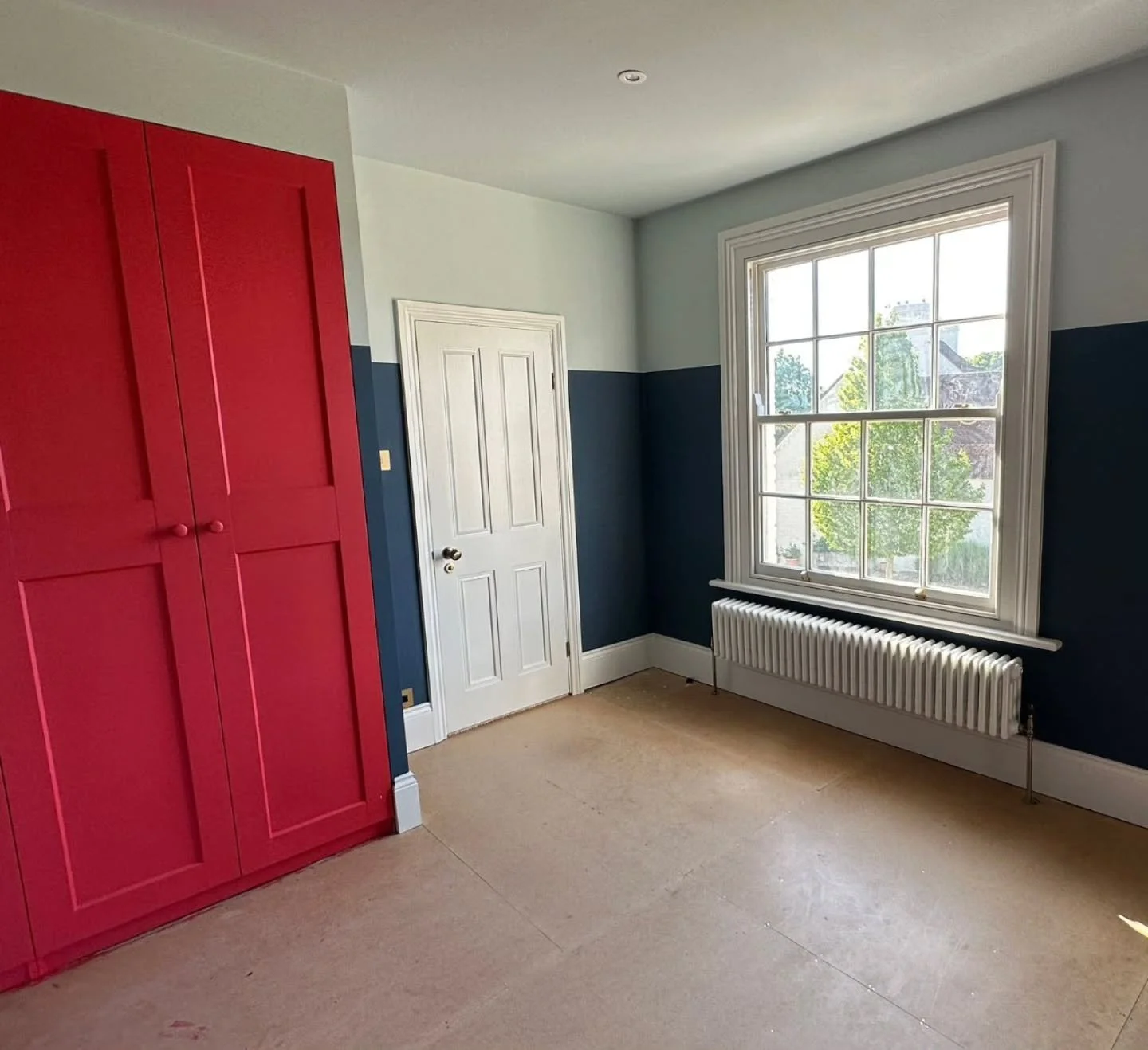 As part of this full-house renovation by GRAPHENE, this space was designed by @summerfield_interiors &mdash; pairing a striking splash of red on the built-in units with crisp two-tone walls for a modern, characterful look.
⠀
We also installed a tradi
