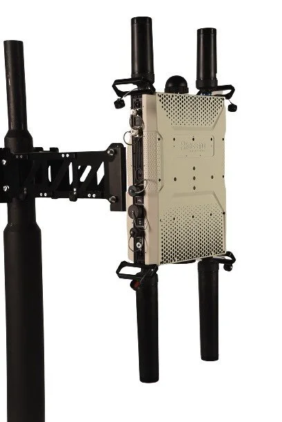 A drone mounted on a black support structure.
