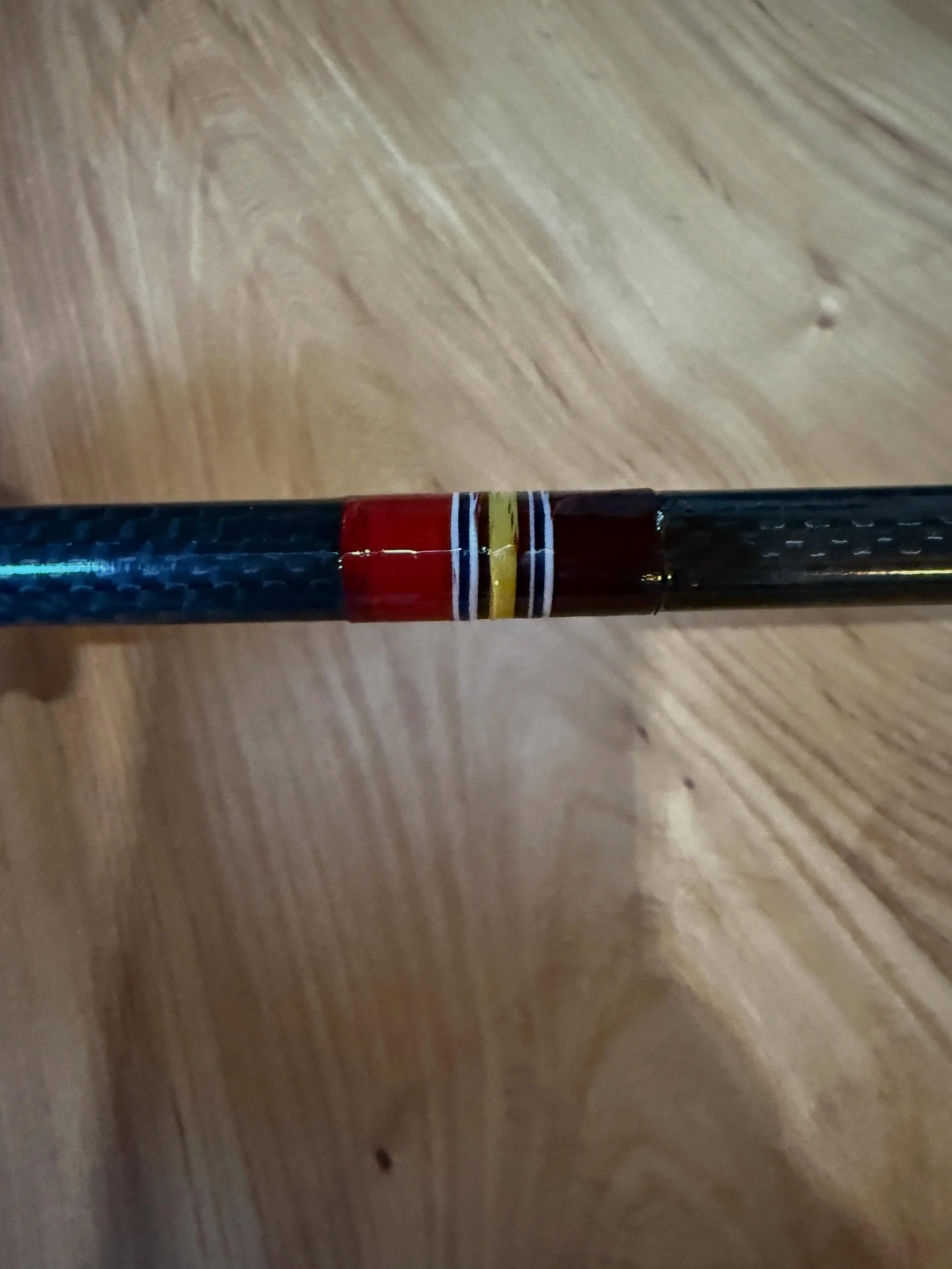 Testing out some colors for a National Defense Service Medal wrap for a veteran theme fly rod. Left side is with color preserver, the right is without. I&rsquo;m moving away from using color preserver on guide wraps because there is concern that it d