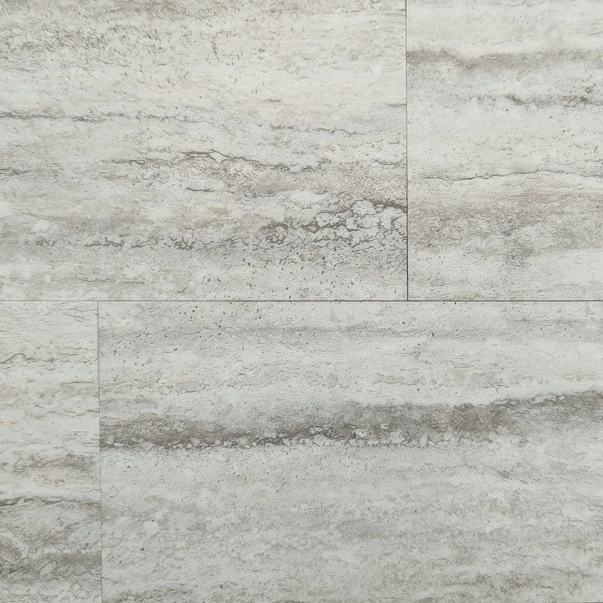 Close-up of a textured, light-colored stone or tile surface with natural patterns and lines.